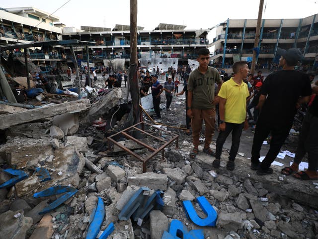 <p>UN staff and Palestinians inspect the site after an Israeli attack on a school of the United Nations Relief and Works Agency for Palestine Refugees in the Near East (UNRWA) in Gaza City, Gaza on 18 July 2024</p>