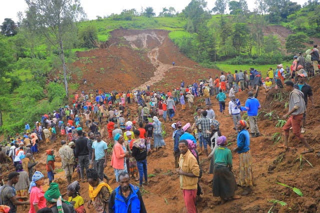 <p>Hundreds of people gather at the site of a mudslide in Gofa, southern Ethiopia</p>