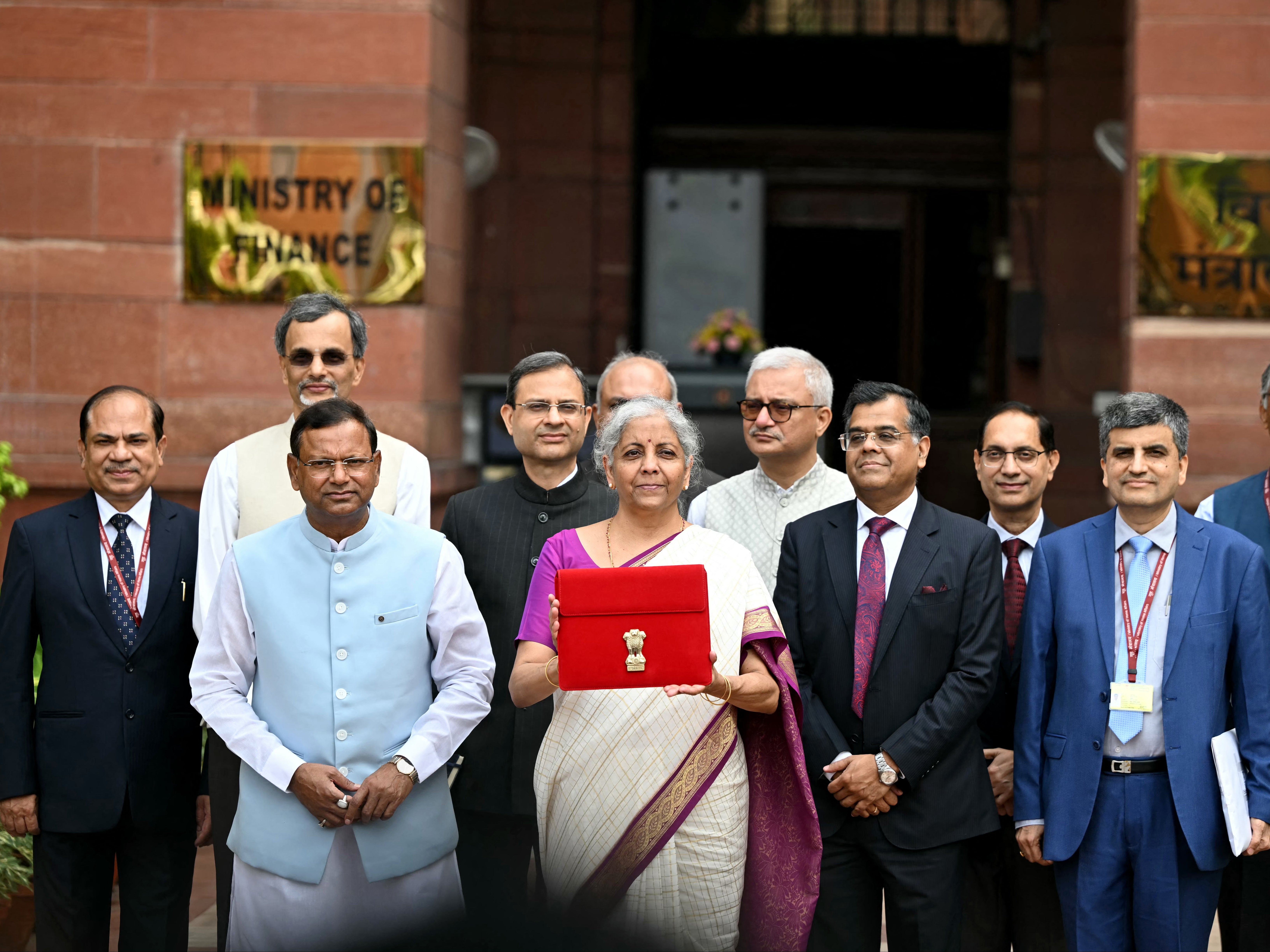 India’s finance minister Nirmala Sitharaman poses for photos before presenting the budget in the parliament on 23 July 2024