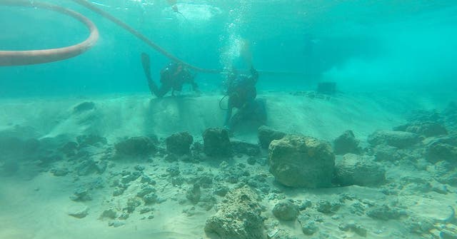 <p>Divers on a research team examine architectural remains at the underwater village of Habonim North, off Israel’s Carmel Coast</p>