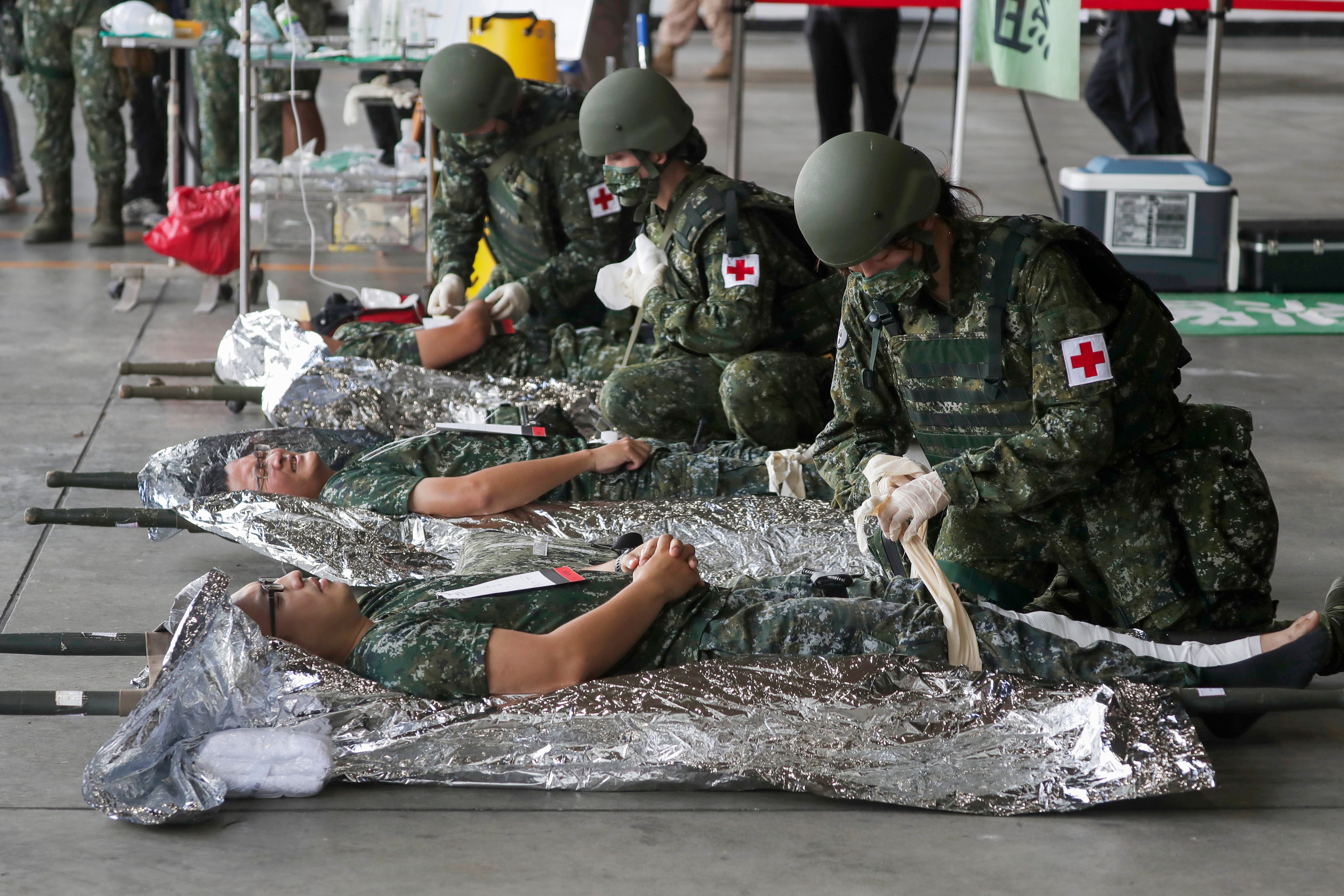 Taiwanese soldiers simulate treatment of injured people during the Han Kuang military exercises