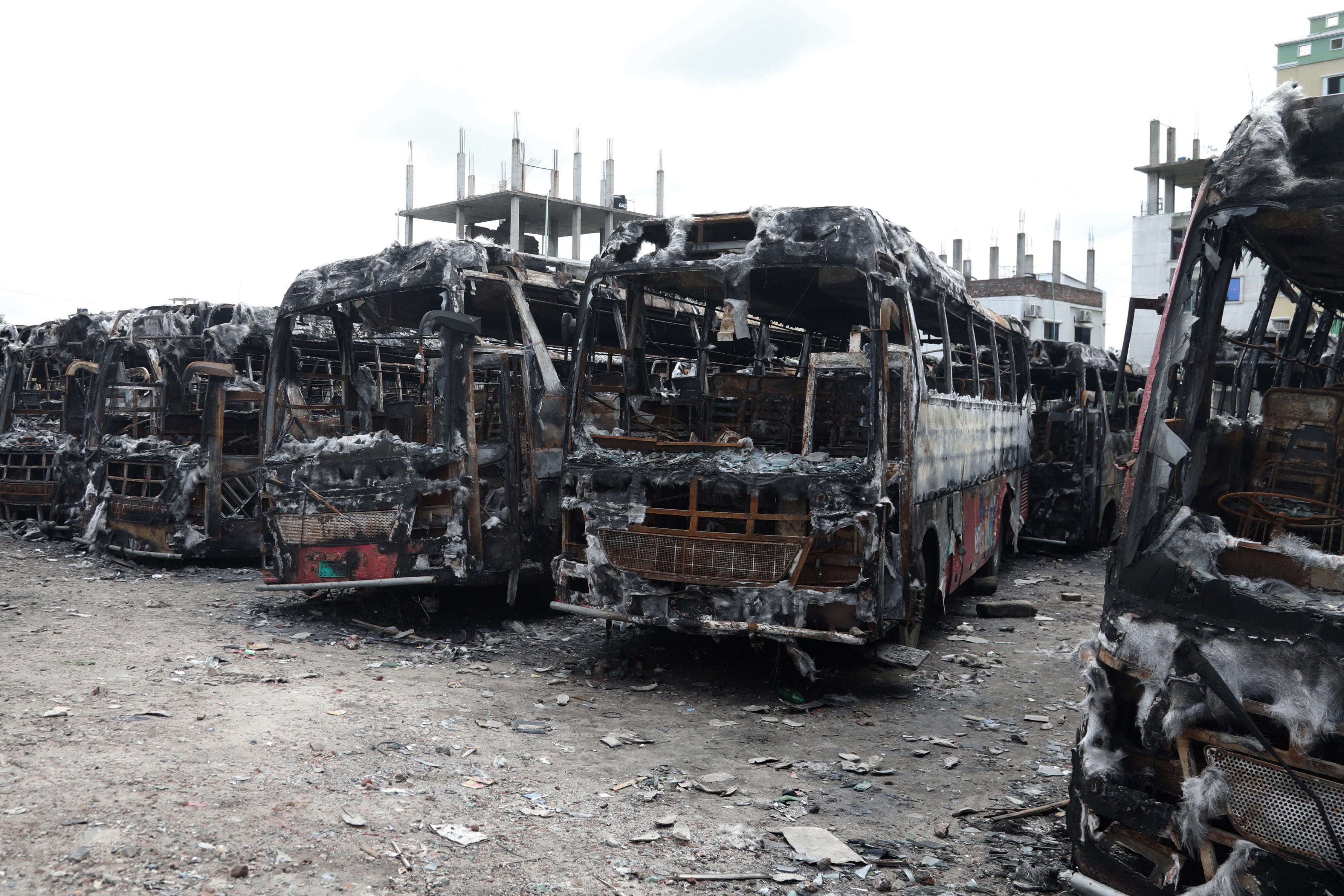 Charred buses at a bus depot in Dhaka, Bangladesh, 23 July 2024