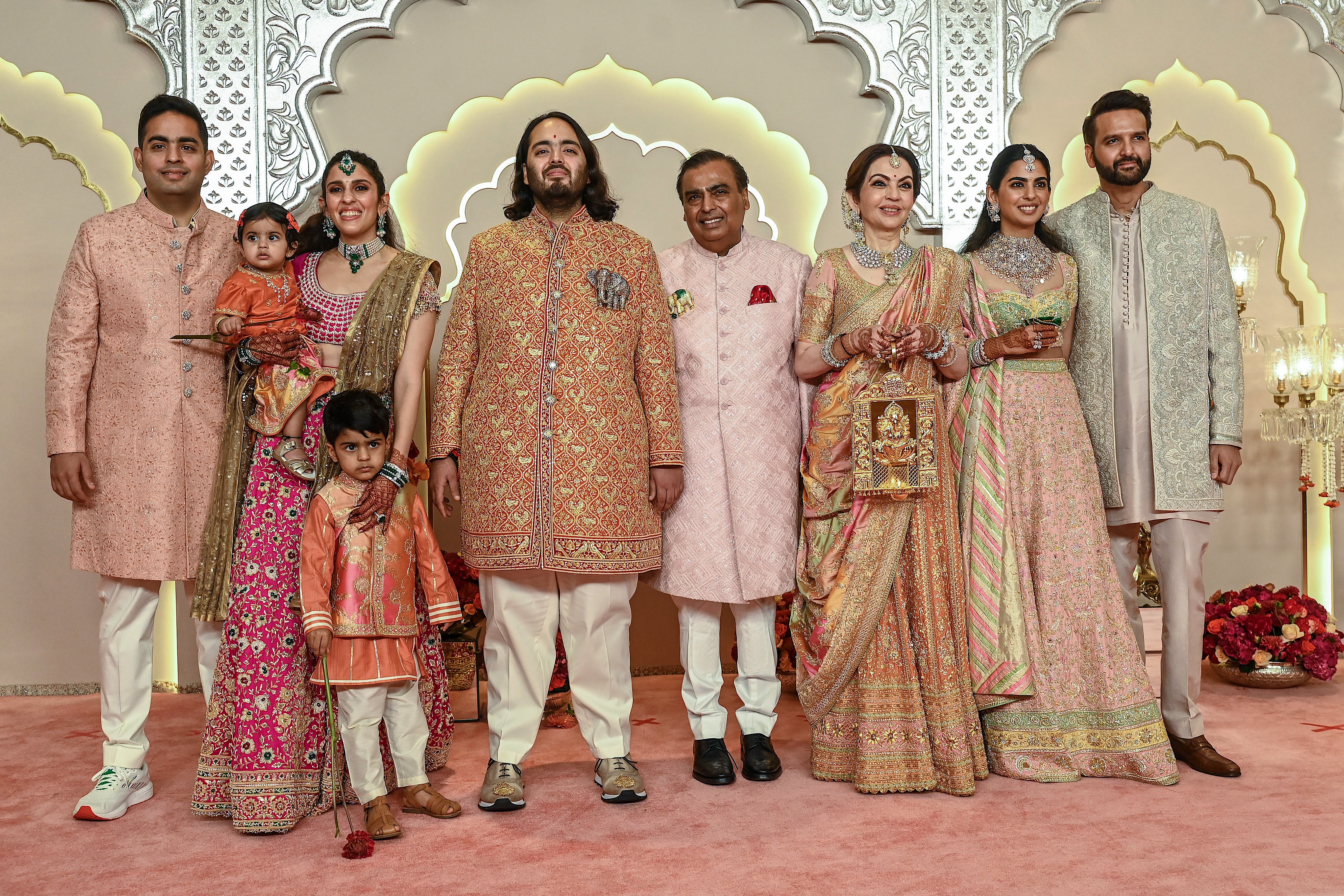 Anant Ambani poses with his family on the red carpet ahead of his wedding ceremony