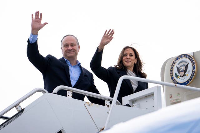 <p>Doug Emhoff and Kamala Harris wave while boarding a plane. Emhoff admitted to having an affair during his first marriage on Saturday </p>