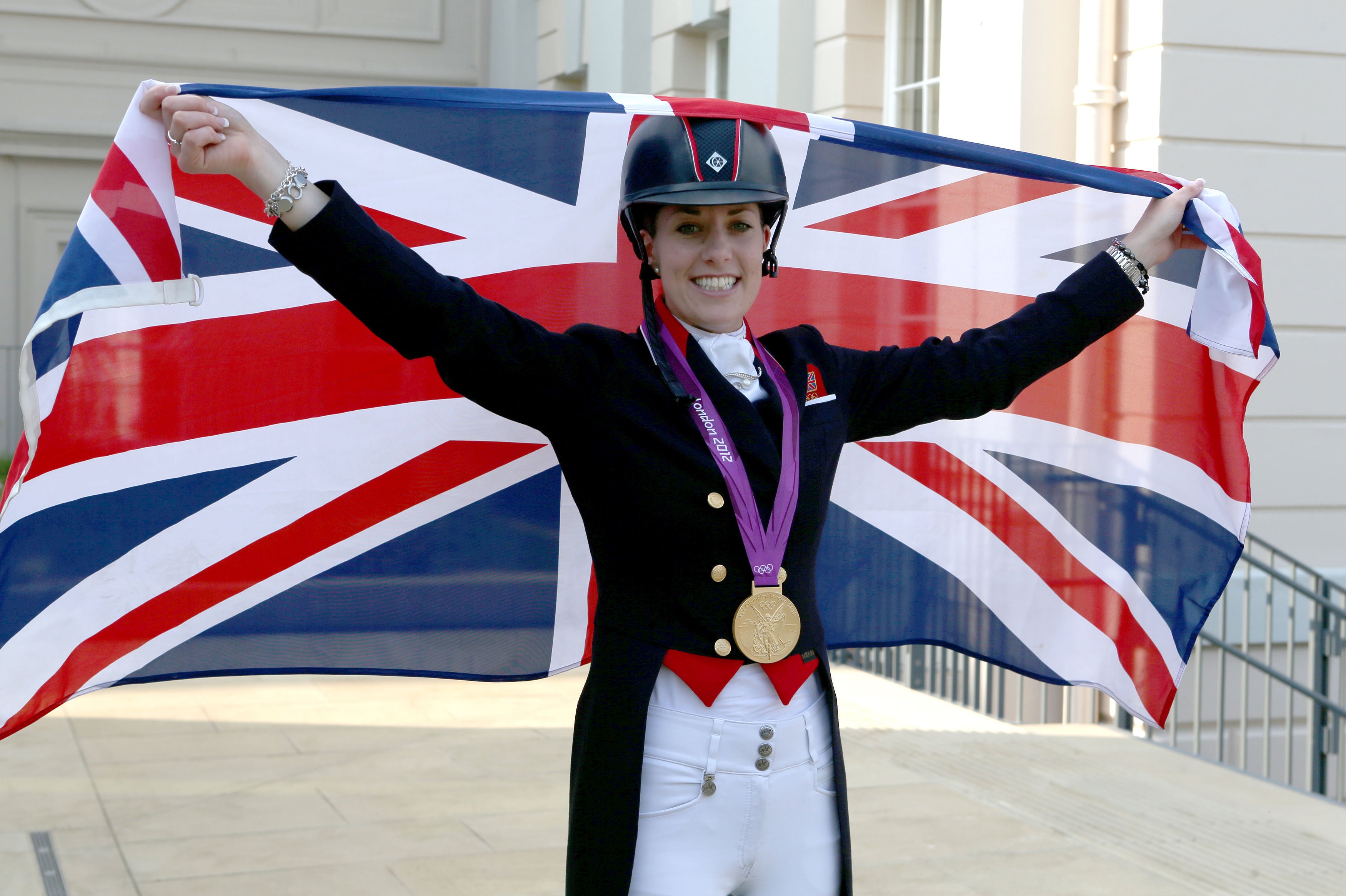 Charlotte Dujardin celebrating after winning gold at London 2012 games