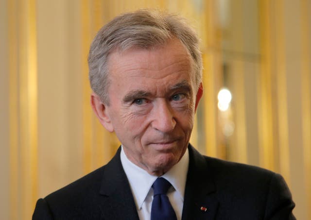 <p>Mr Arnault, who founded the luxury firm LVMH, has an estimated net worth of £135bn </p>