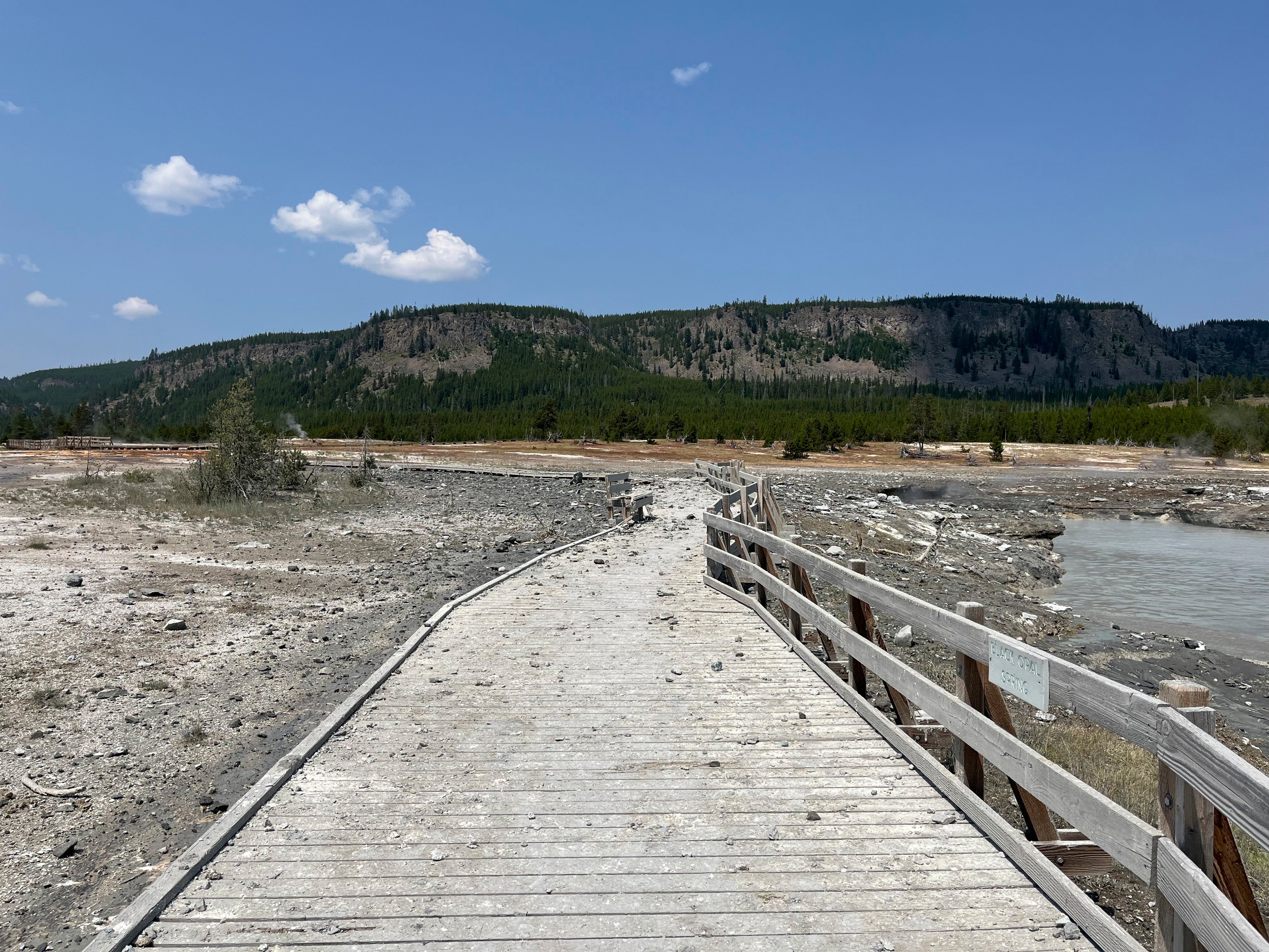 Debris litter the damaged Biscuit Basin boardwalks after a hydrothermal explosion at Biscuit Basin in Yellowstone National Park