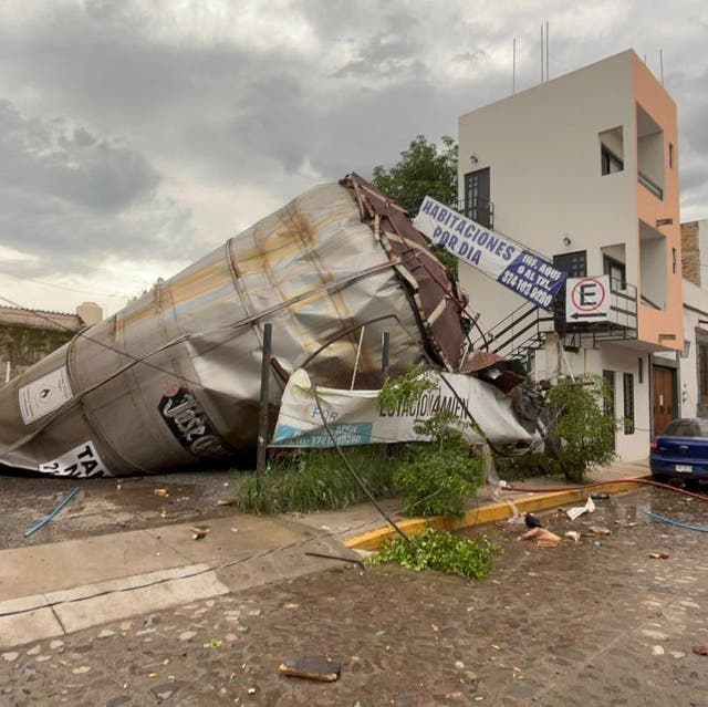 <p>A photograph released by Jalisco authorities showed a damaged metallic container, crumpled after the explosion</p>