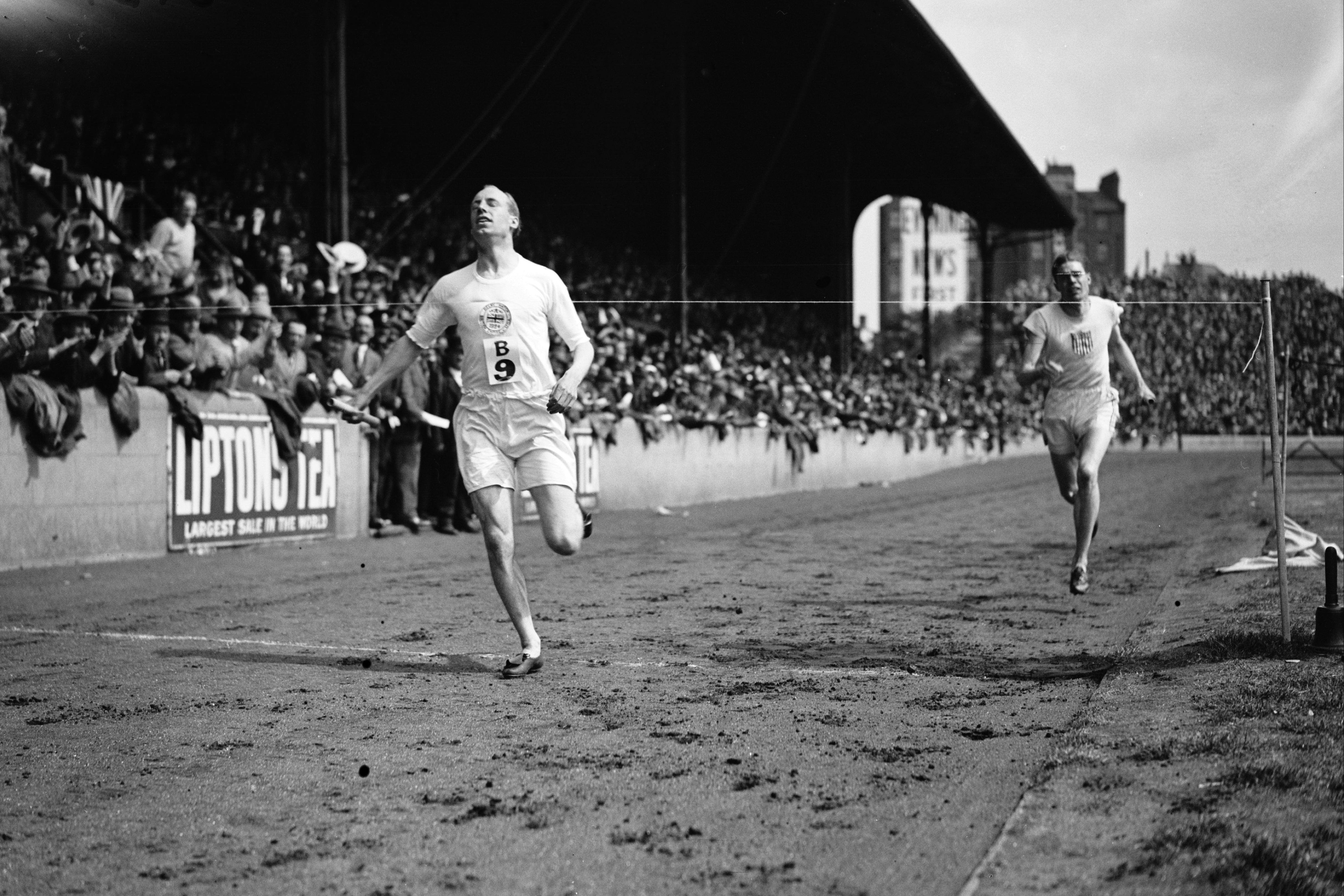 Liddell wins the one-mile relay at an international athletics meeting in July 1924