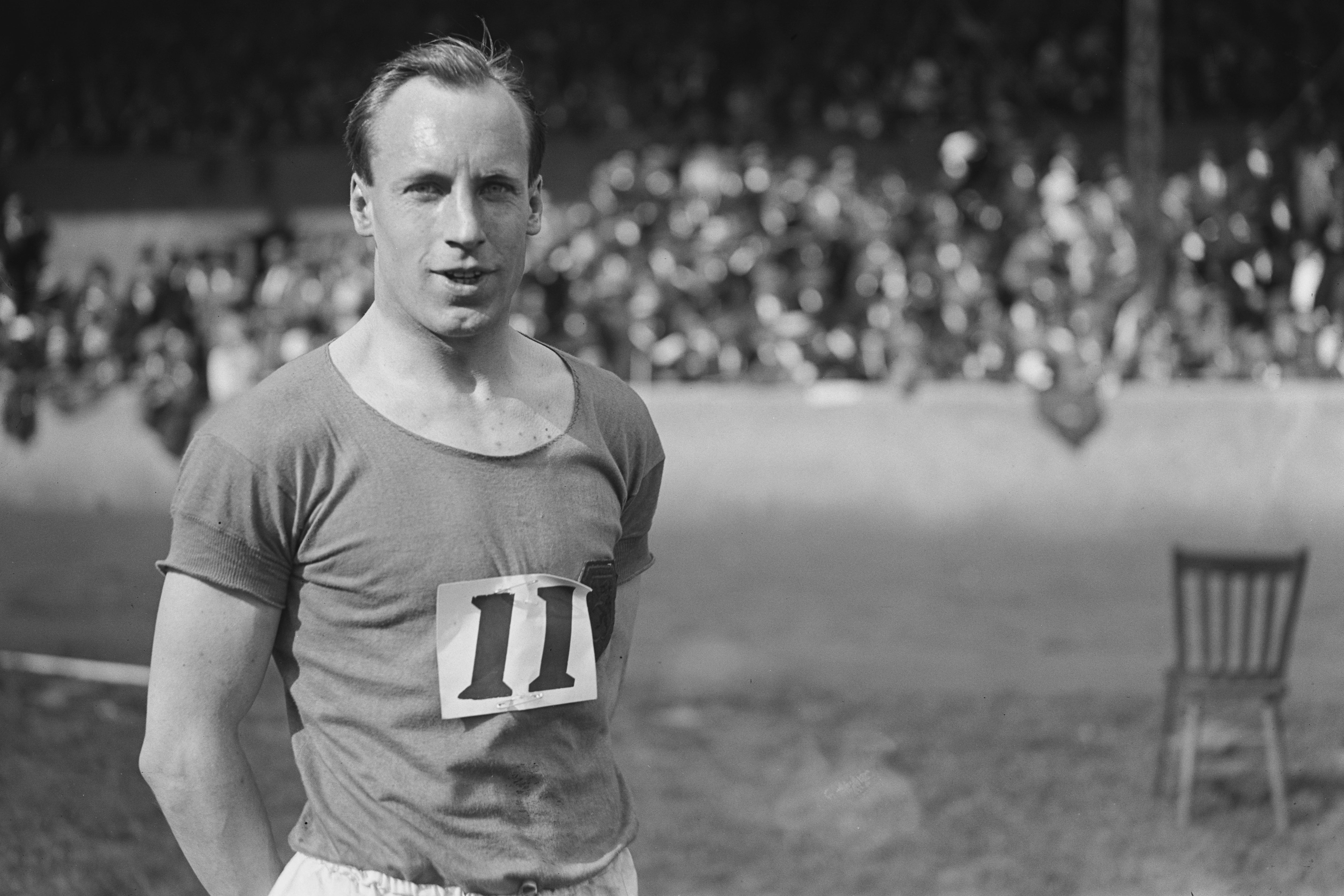 Liddell, winner of the quarter-mile event at the Amateur Athletics Association championships, poses on the track at Stamford Bridge stadium in London, June 1924