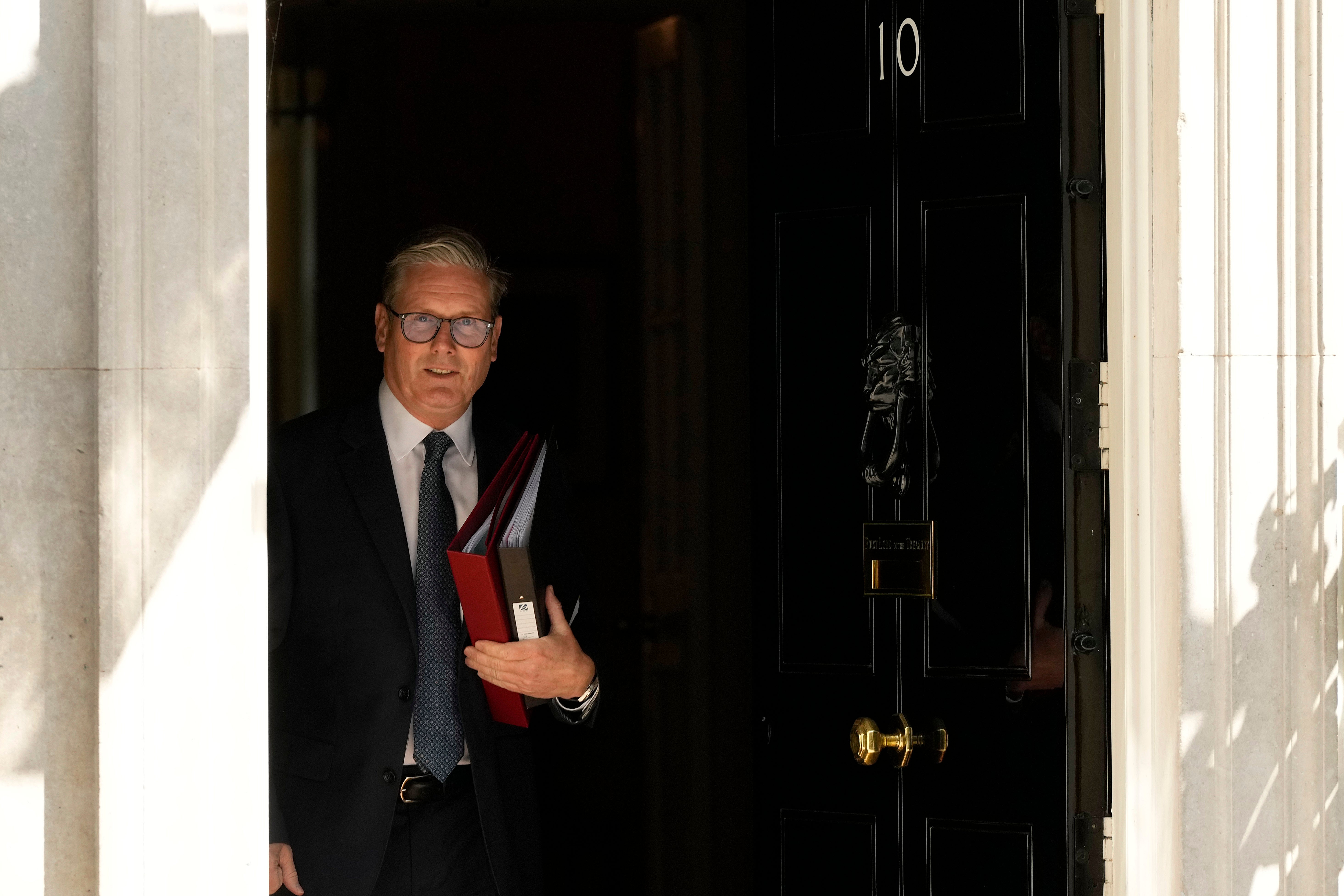 British Prime Minister Keir Starmer leaves 10 Downing Street to attend the weekly Prime Minister's Questions in the Houses of Parliament in London.