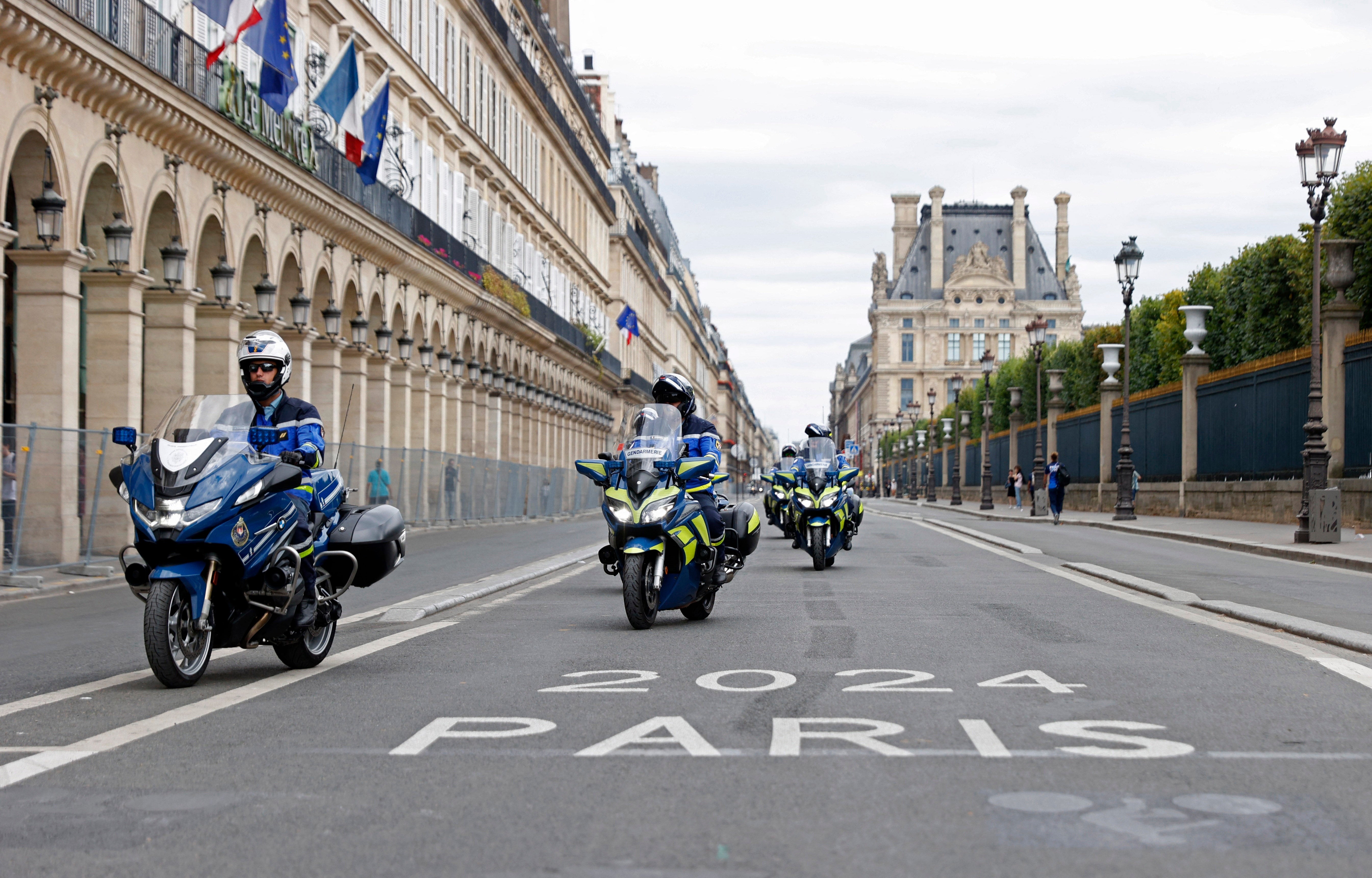 French police officers are seen on motorbikes ahead of the Paris Olympics