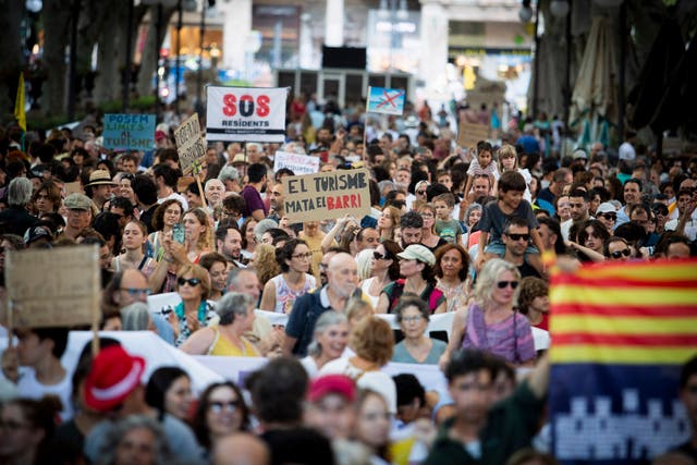 <p>Demonstrators taking part in a overtourism protest in Palma de Mallorca in July 2024</p>
