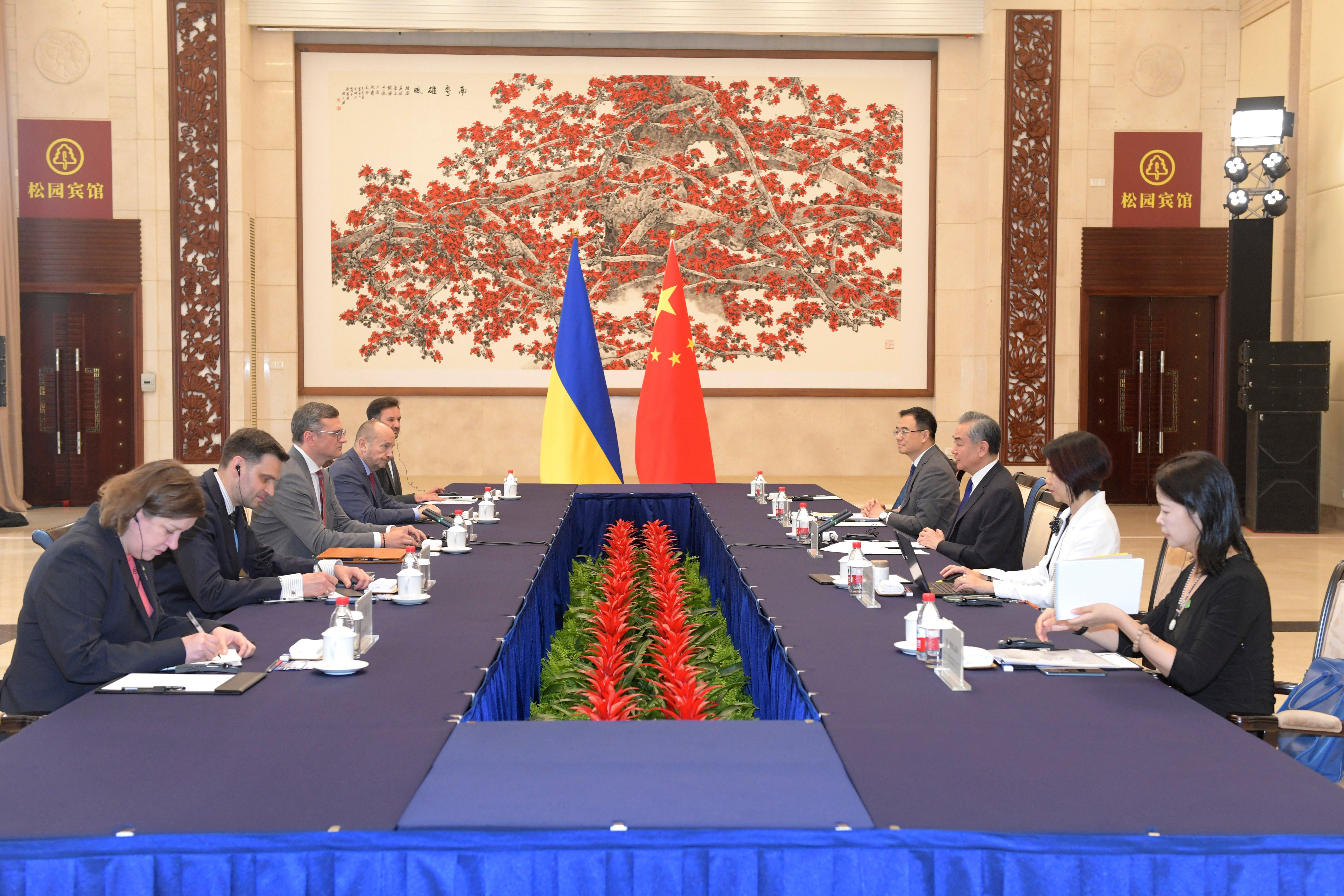 In this photo released by Xinhua News Agency, Ukraine's Foreign Ministry Dmytro Kuleba, third from left holds talks with China's Foreign Minister Wang Yi at a meeting in the southern Chinese city of Guangzhou