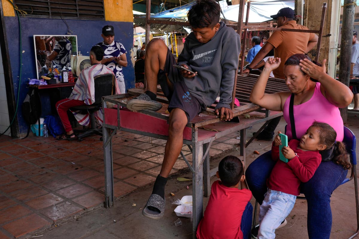 Venezuelans turn to odd jobs and gambling to stretch meager wages they hope will grow after election