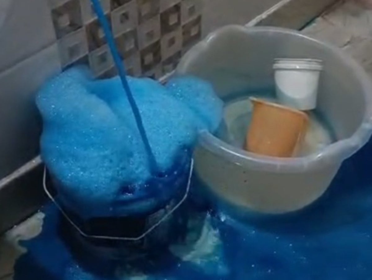 Bright blue water flows from taps in Delhi homes – residents are mystified