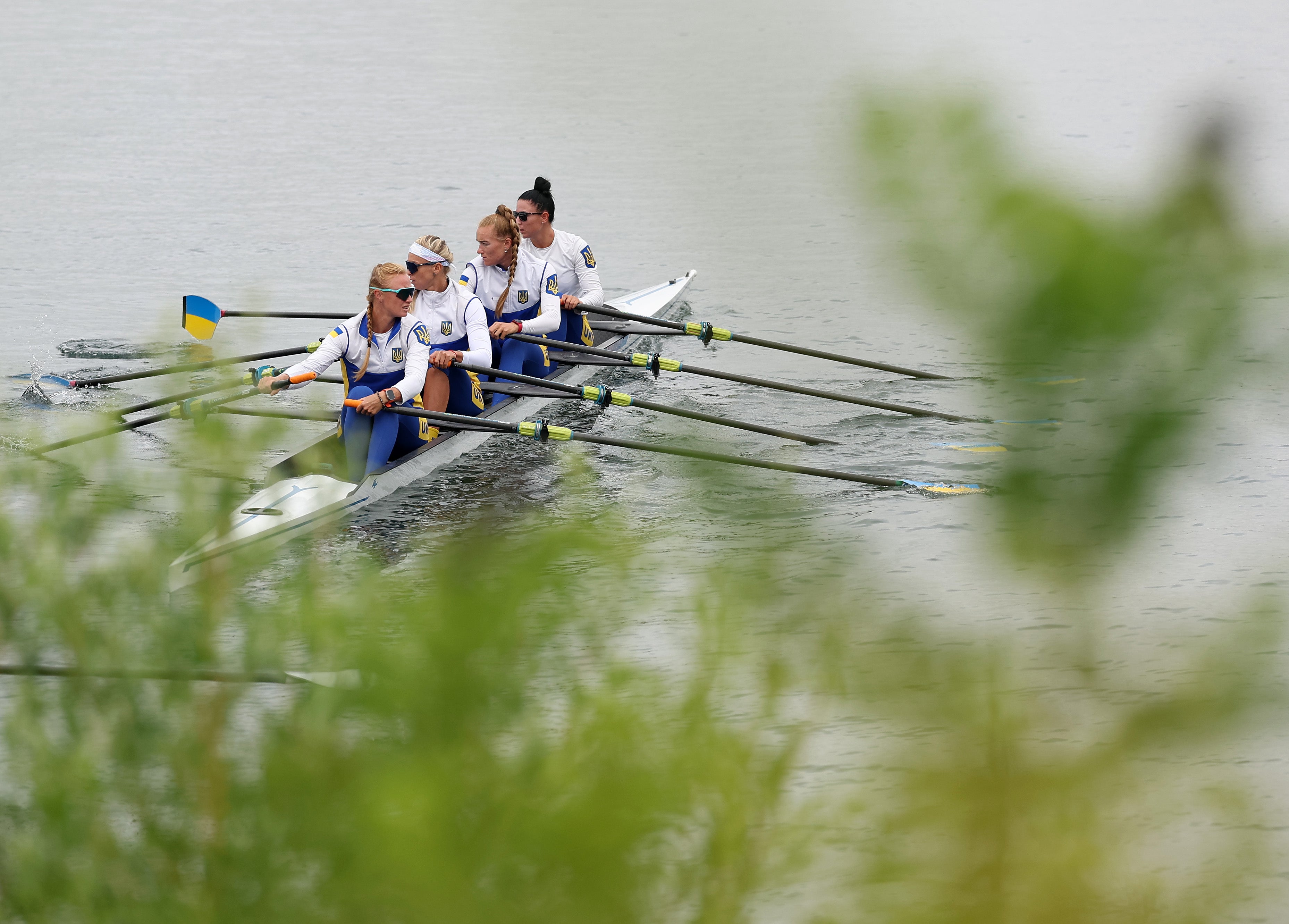 The Ukraine Women’s Quadruple Skulls boat takes to the water ahead of the Rowing at Vaires-Sur-Marne Nautical Stadium