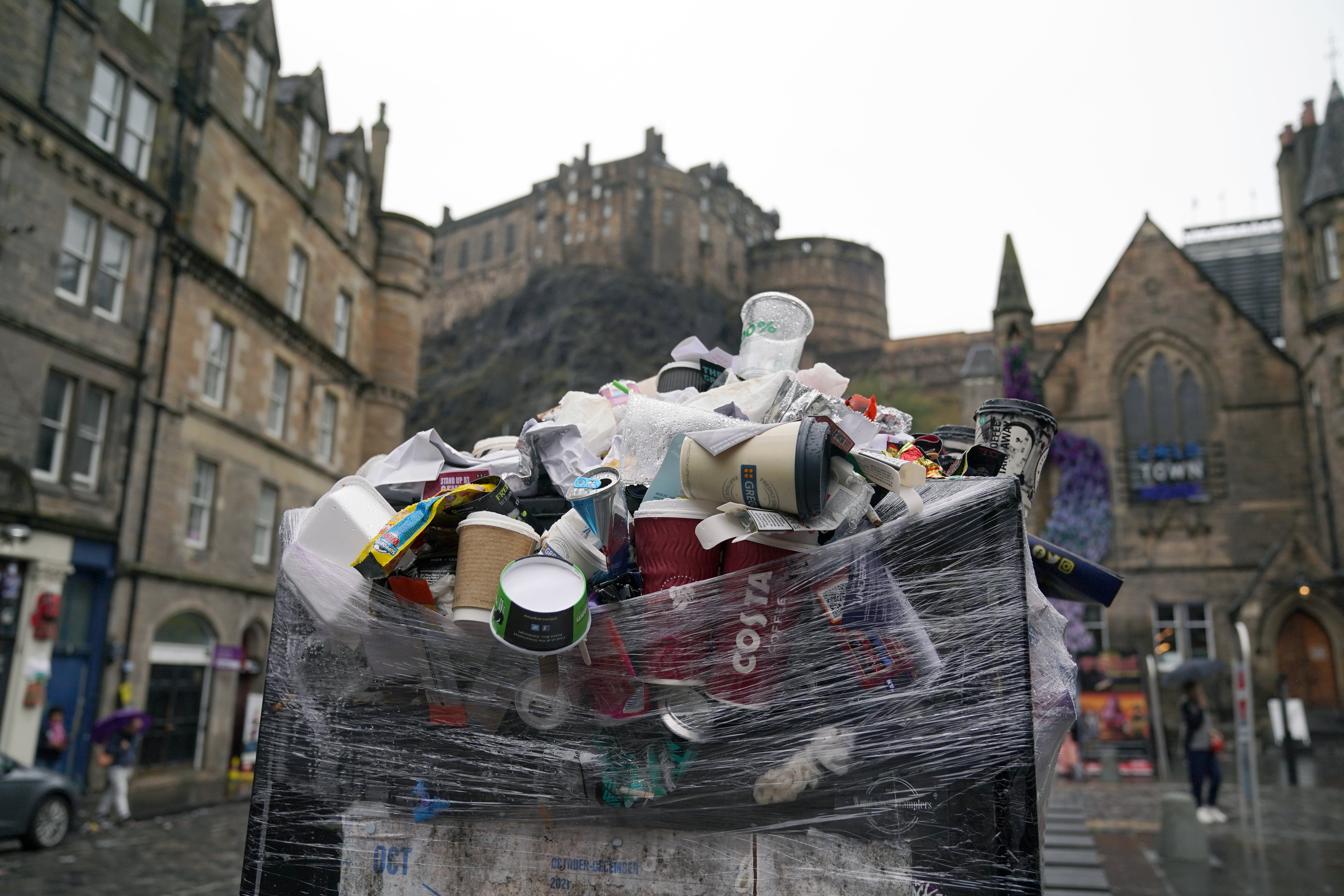 Previous strike action by cleansing workers in Edinburgh in 2022 left rubbish piled up during festival season (PA)