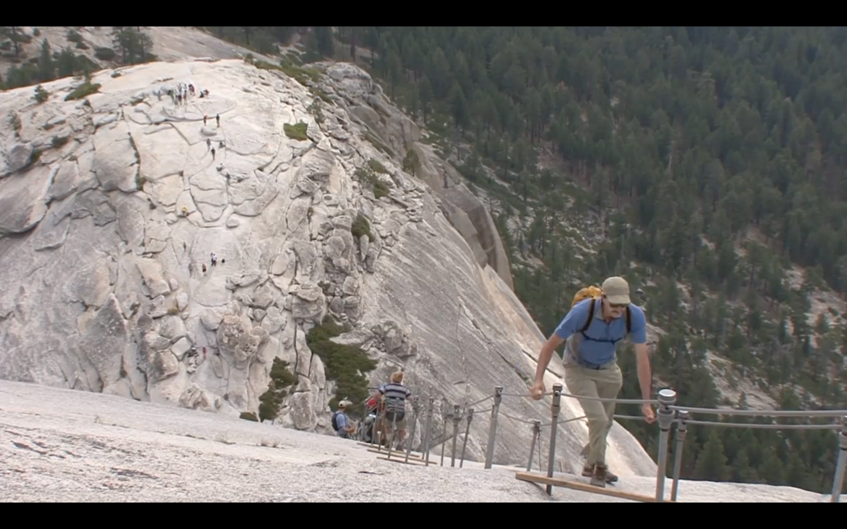 Man climbs up Yosemite’s Half Dome cables