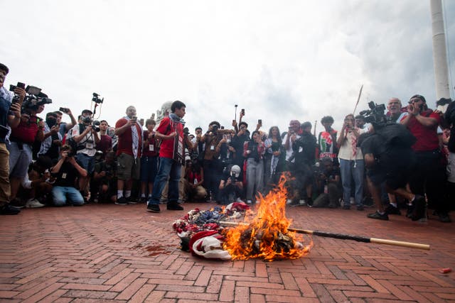 <p>Pro-Palestinian protesters burn a US flag at Union Station on July 24, 2024 during a protest against Israeli Prime Minister Benjamin Netanyahu’s visit to the US</p>