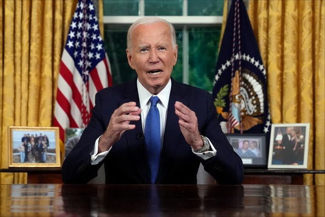 <p>Joe Biden sits behind his desk in the Oval Office and delivers remarks following his announcement he is leaving the 2024 presidential race </p>
