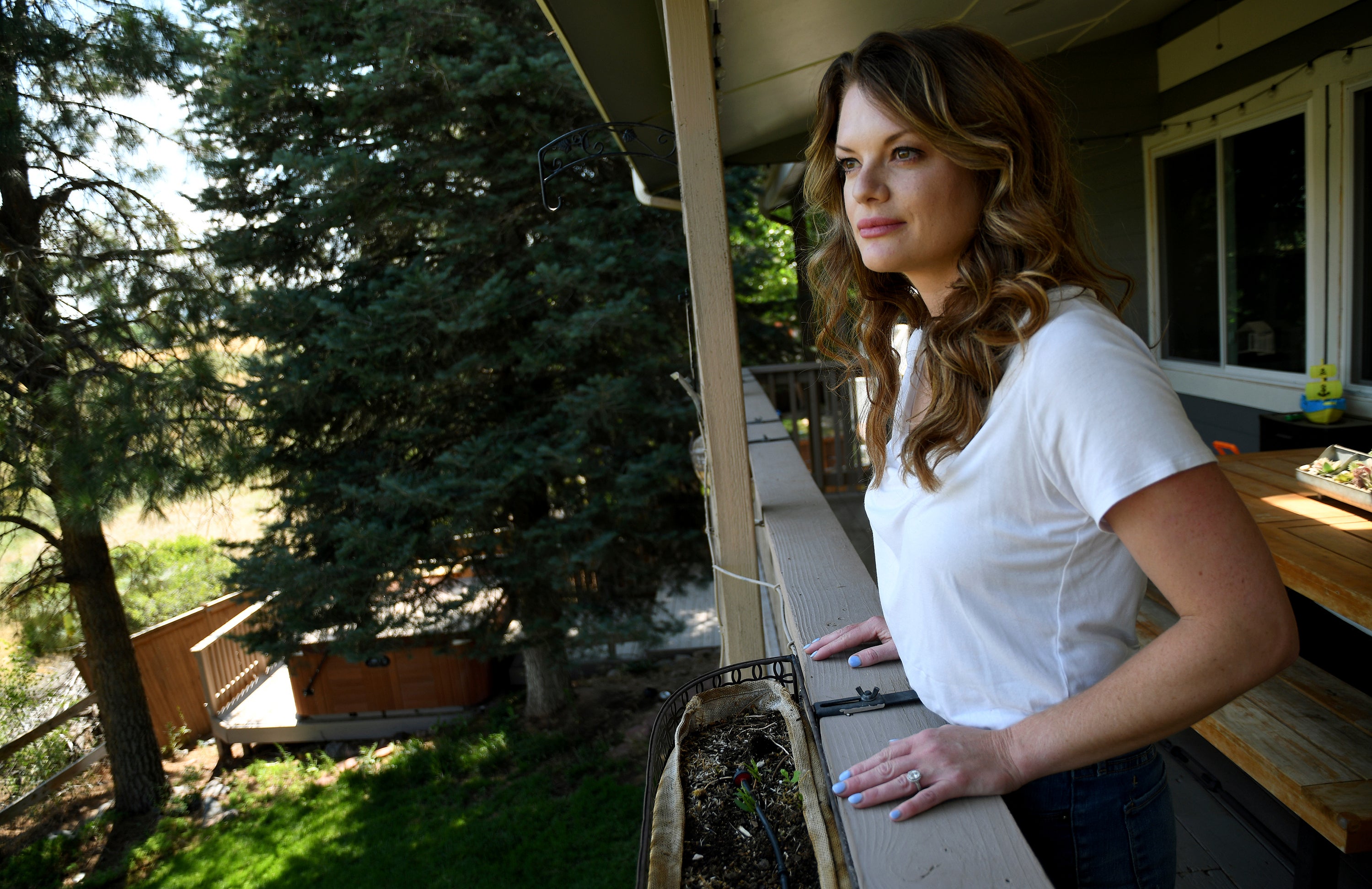 Sonia Moran looks at a meadow owned by The Rock church from her patio in Castle Rock