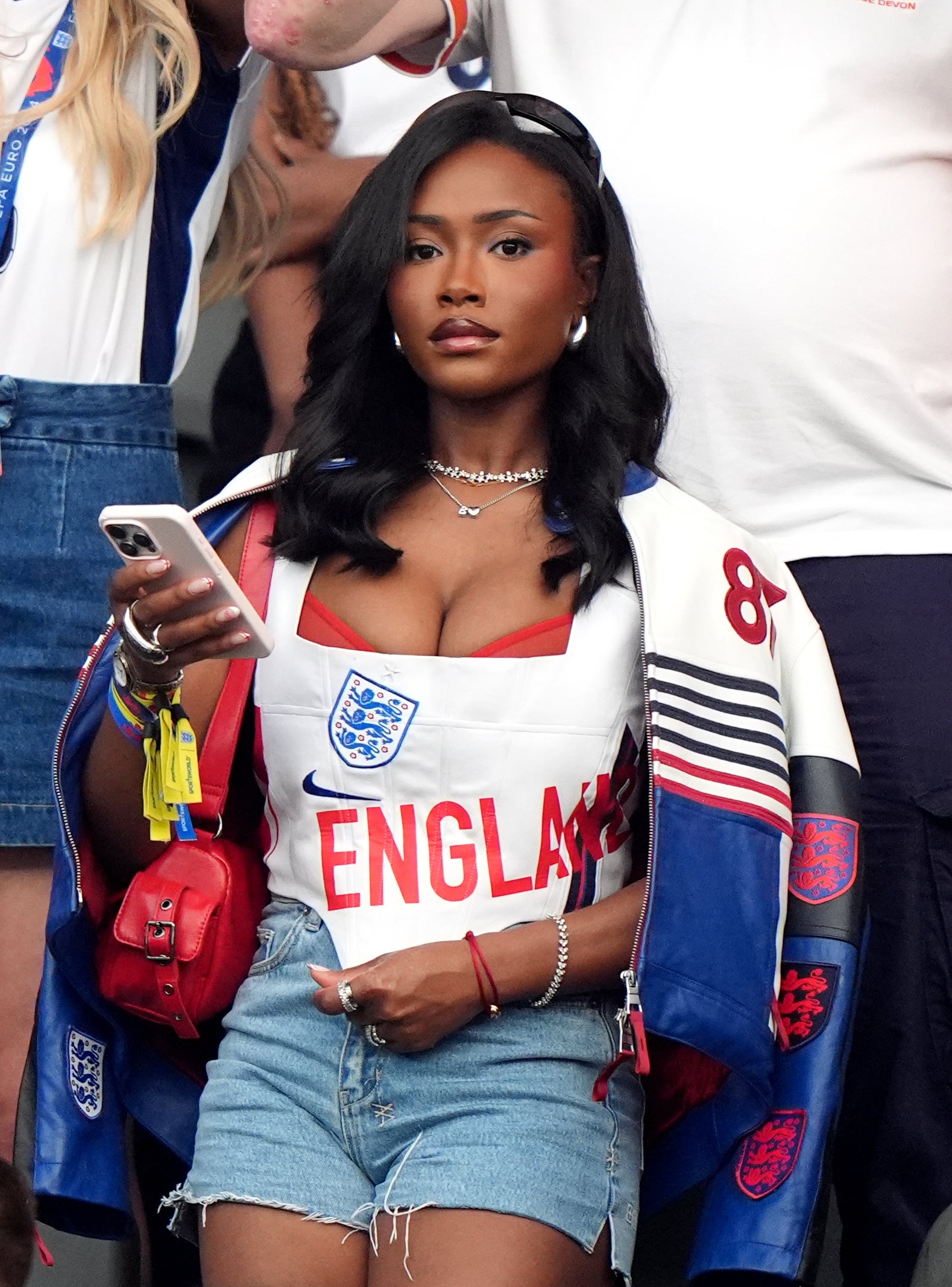 Tolami Benson accented her England football look with a sheer red bralette (Bradley Collyer/PA)