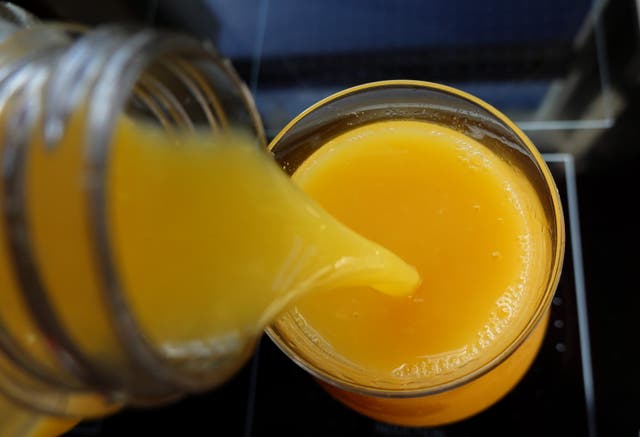 <p>Orange juice is poured into a glass in Miami, Florida</p>