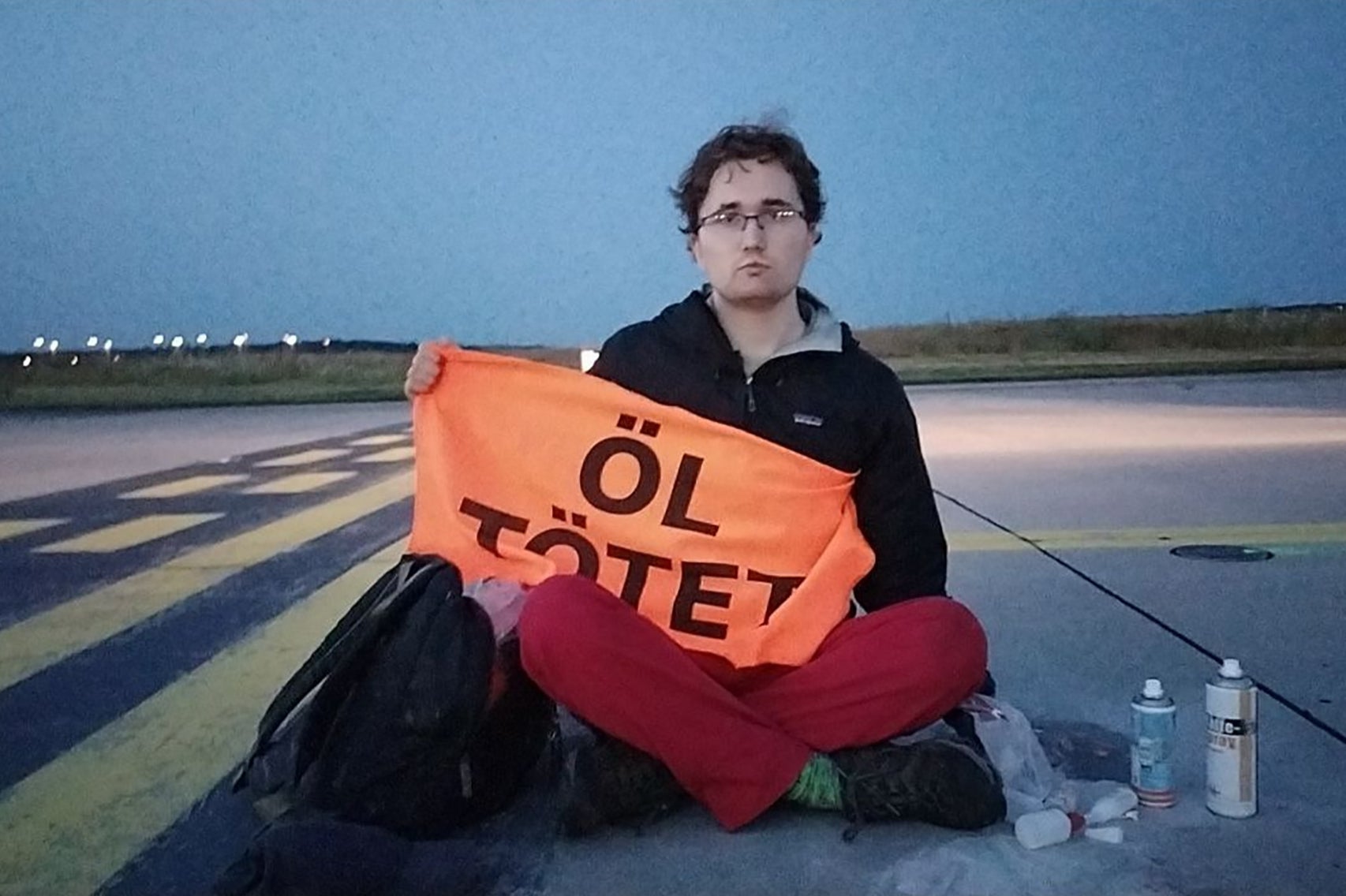 Closing time: Protester on the airfield at Frankfurt airport