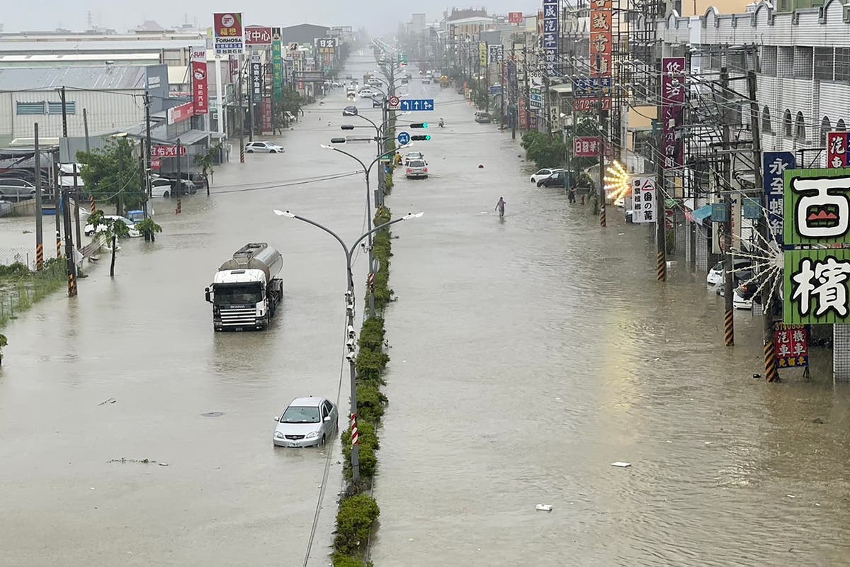 Typhoon Gaemi hits China, forcing thousands to flee after 25 killed – live