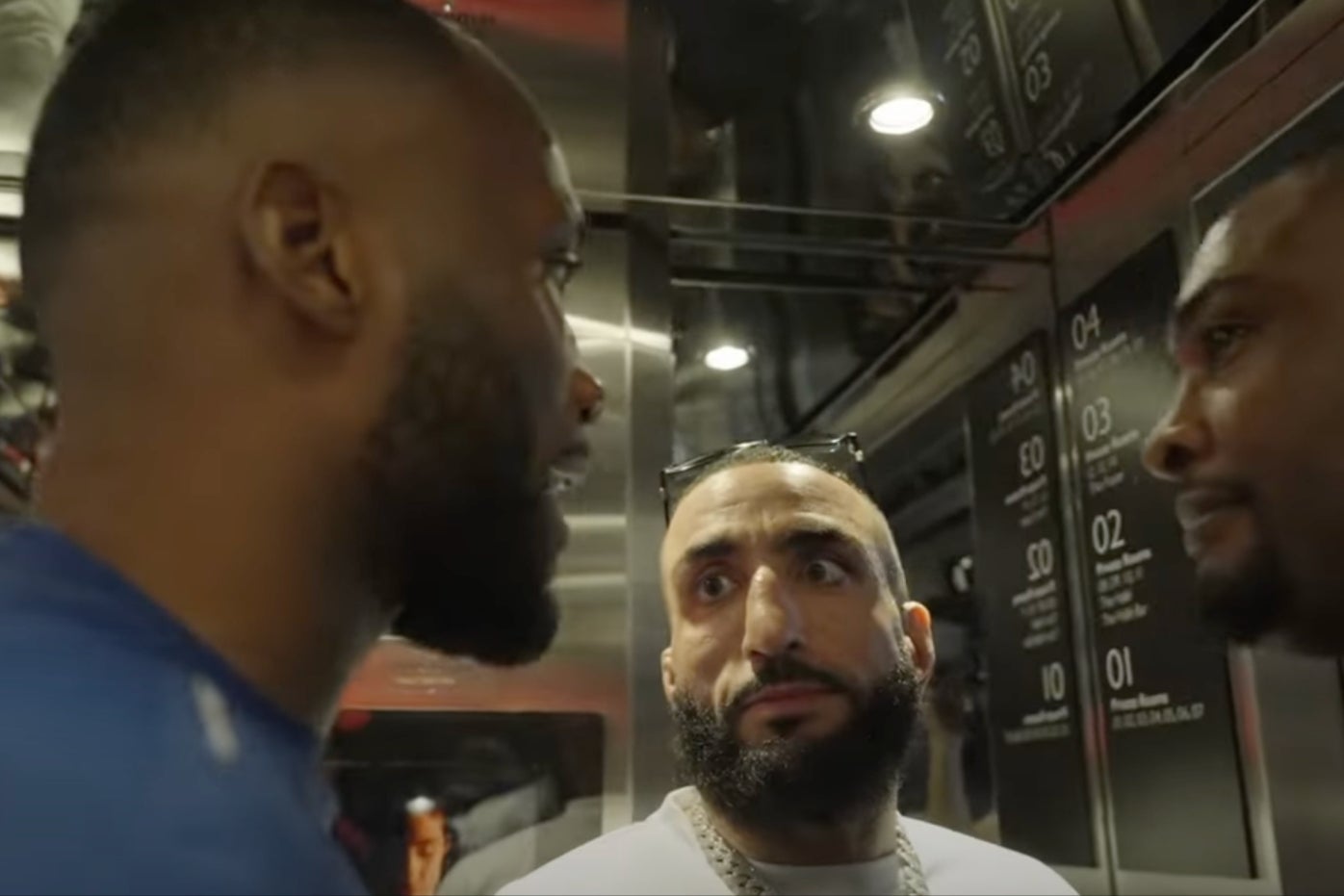 UFC champion Leon Edwards (left) with title challenger Belal Muhammad (centre)