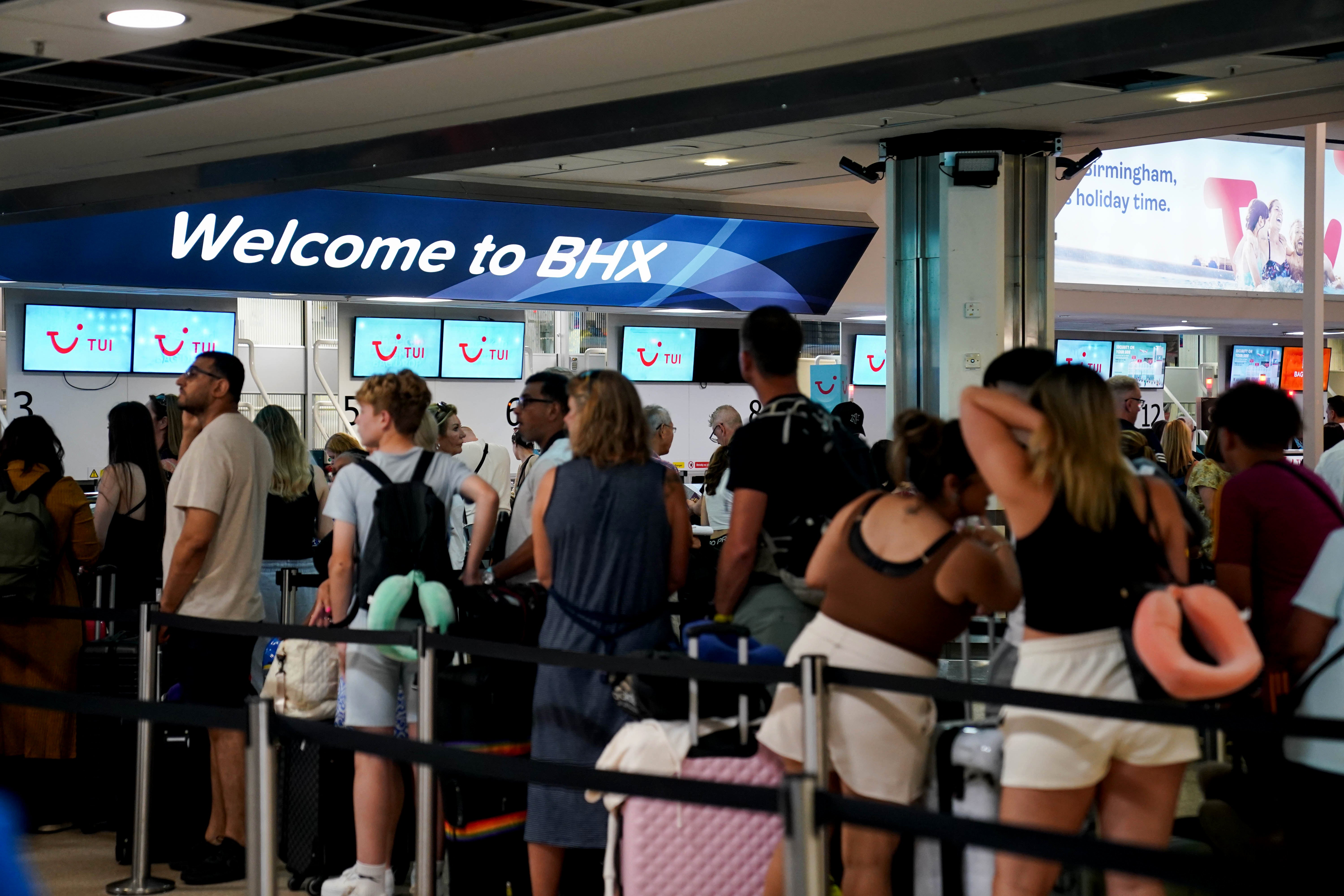 Passengers queue at Birmingham Airport during the IT outage (Jacob King/PA)