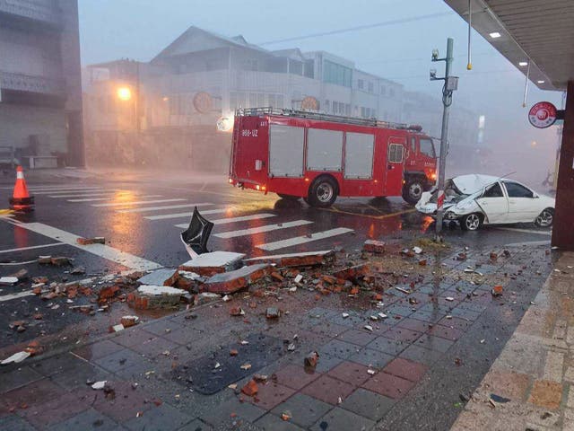 <p>A car was hit by a falling wall amid Typhoon Gaemi </p>