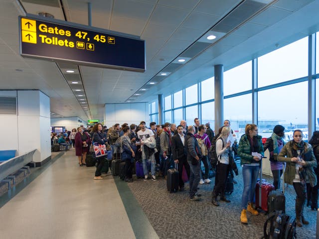 <p>Air travellers waiting in queue for boarding at London Stansted Airpor</p>