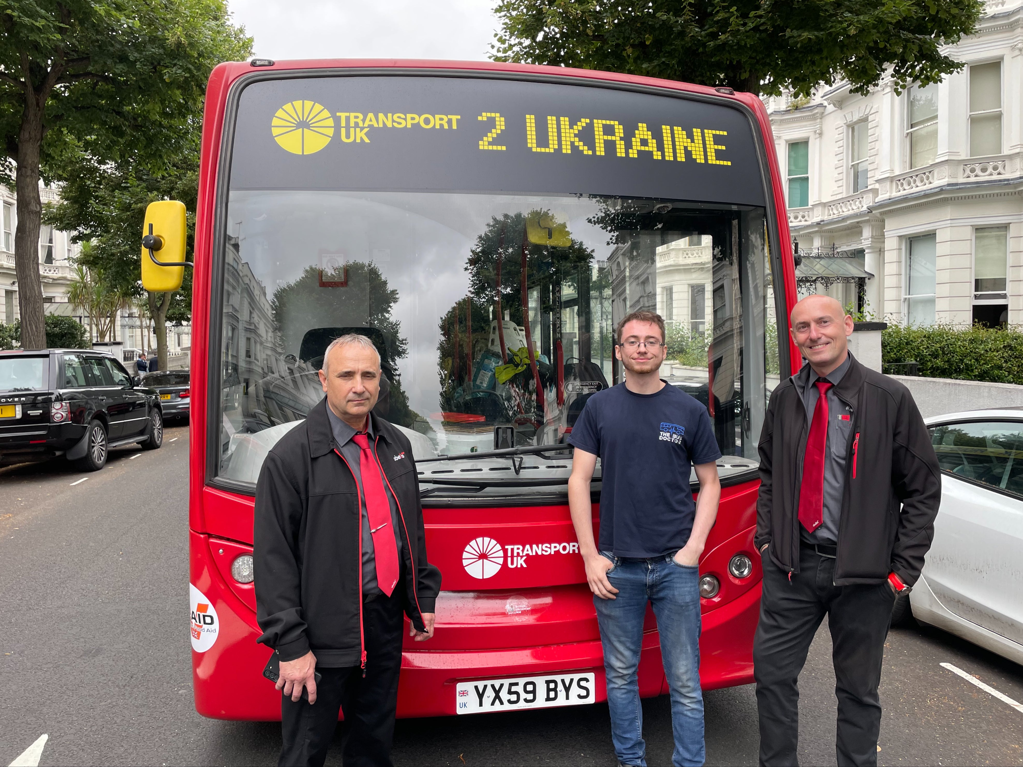 Ukrainian-born Serhiy, engineer Reece and Polish-born Piotr posed in front of their repurposed London bus, packed with humanitarian aid and ready to be driven to Ukraine