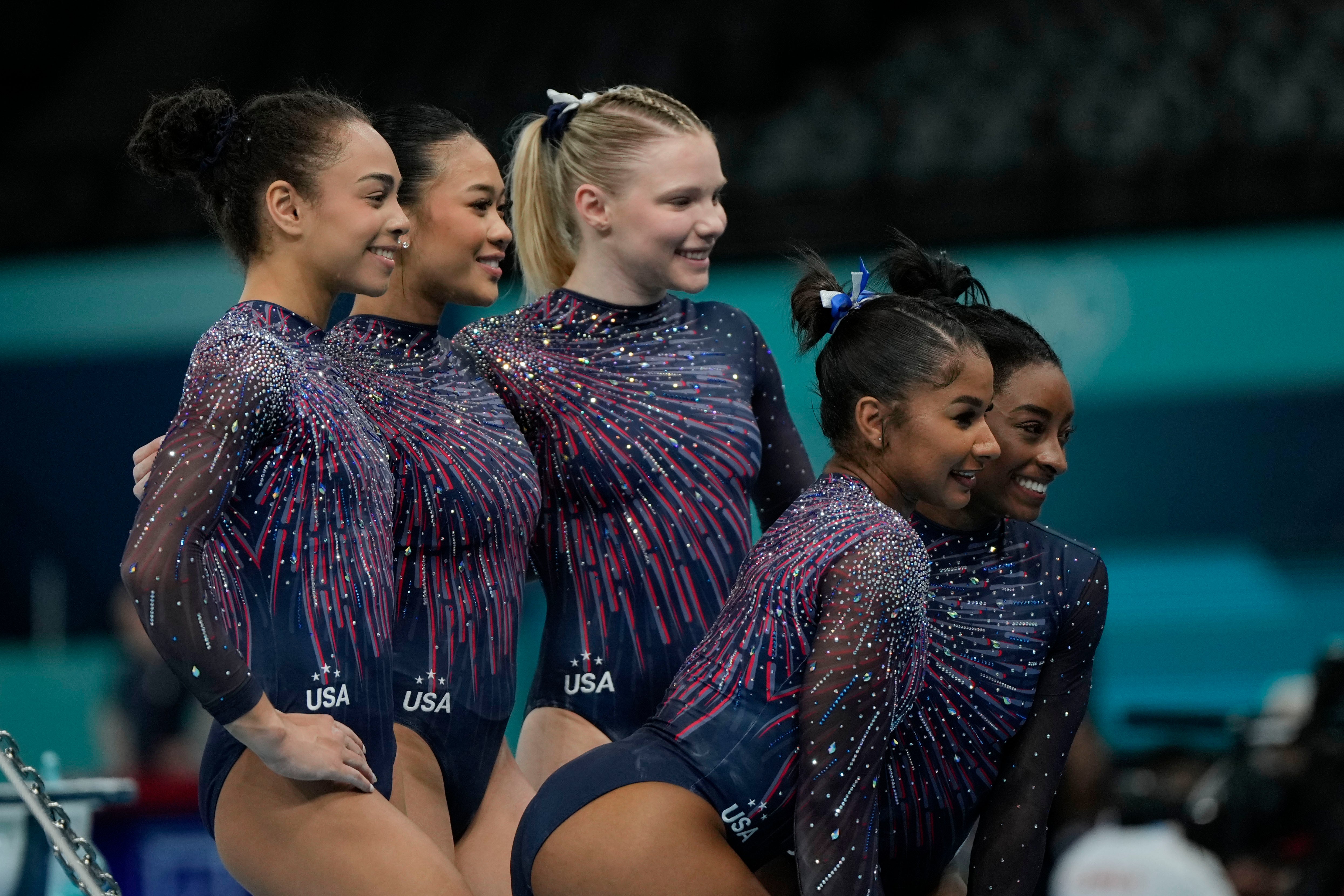 The United States team from left to right, Hezly Rivera, Suni Lee, Jade Carey, Jordan Chiles and Simone Biles