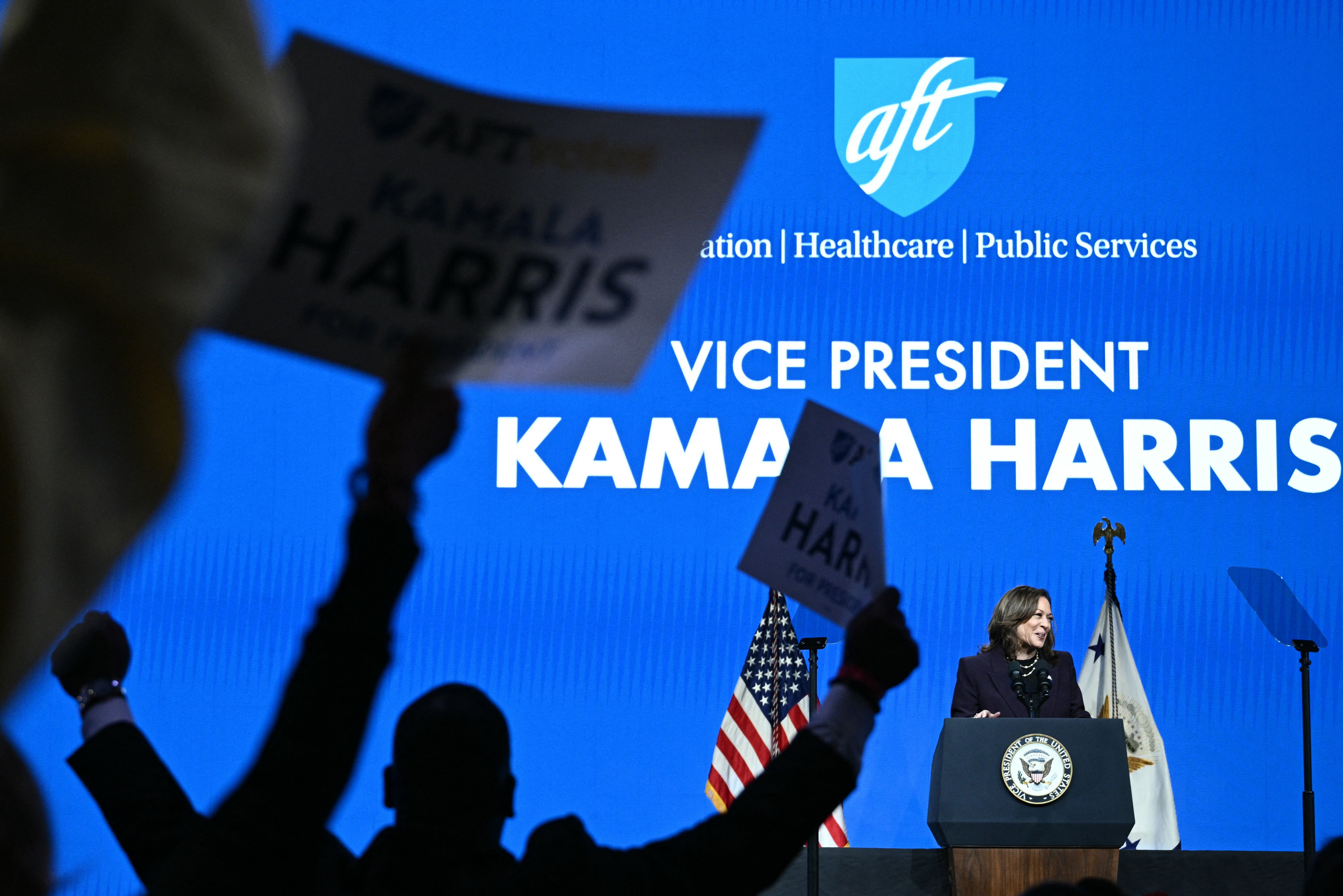 Attendees watch as Vice President Kamala Harris delivers the keynote speech at the American Federation of Teachers’ 88th National Convention