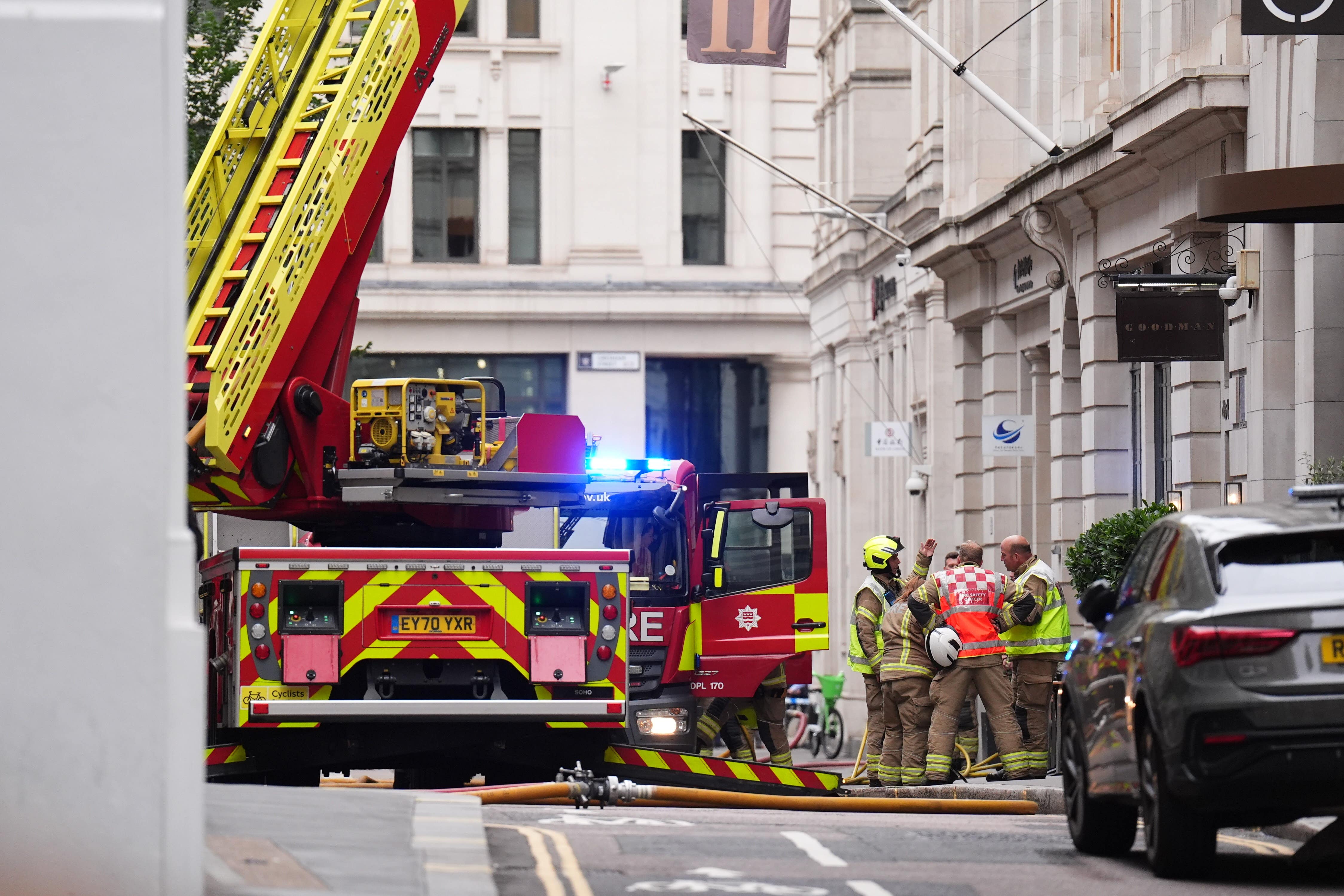 Firefighters in Old Jewry St in London after a fire broke out at a restaurant in the City of London (James Manning/PA)