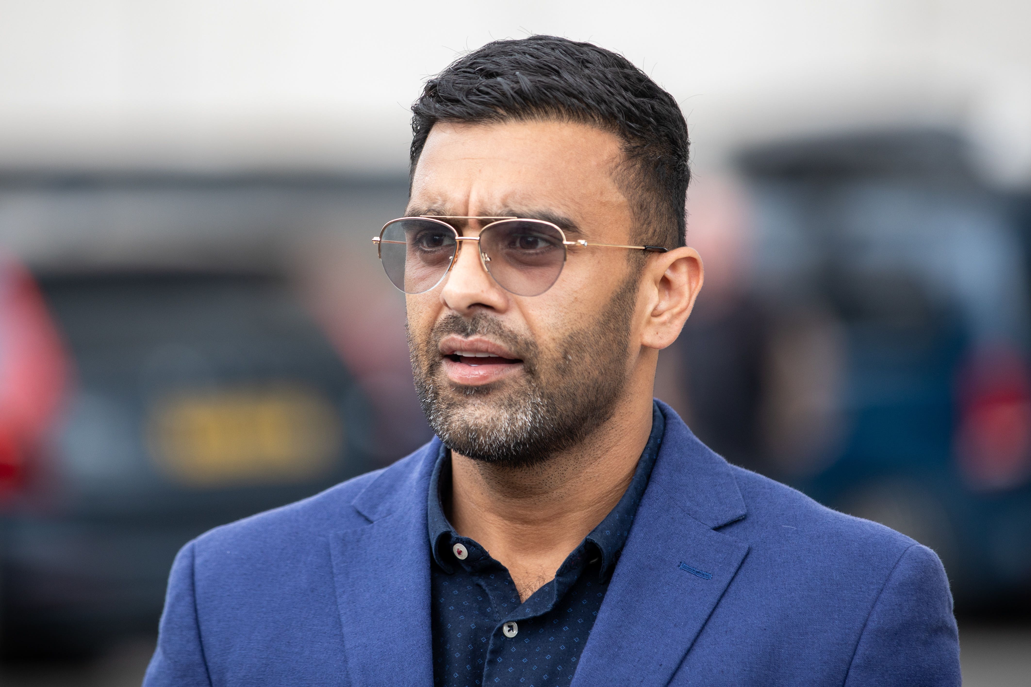 Solicitor Akhmed Yakoob speaks to the media outside Rochdale police station following the suspension of a police officer after a video which appeared to show a man being kicked as he lay on the floor sparked a protest (James Speakman/PA)