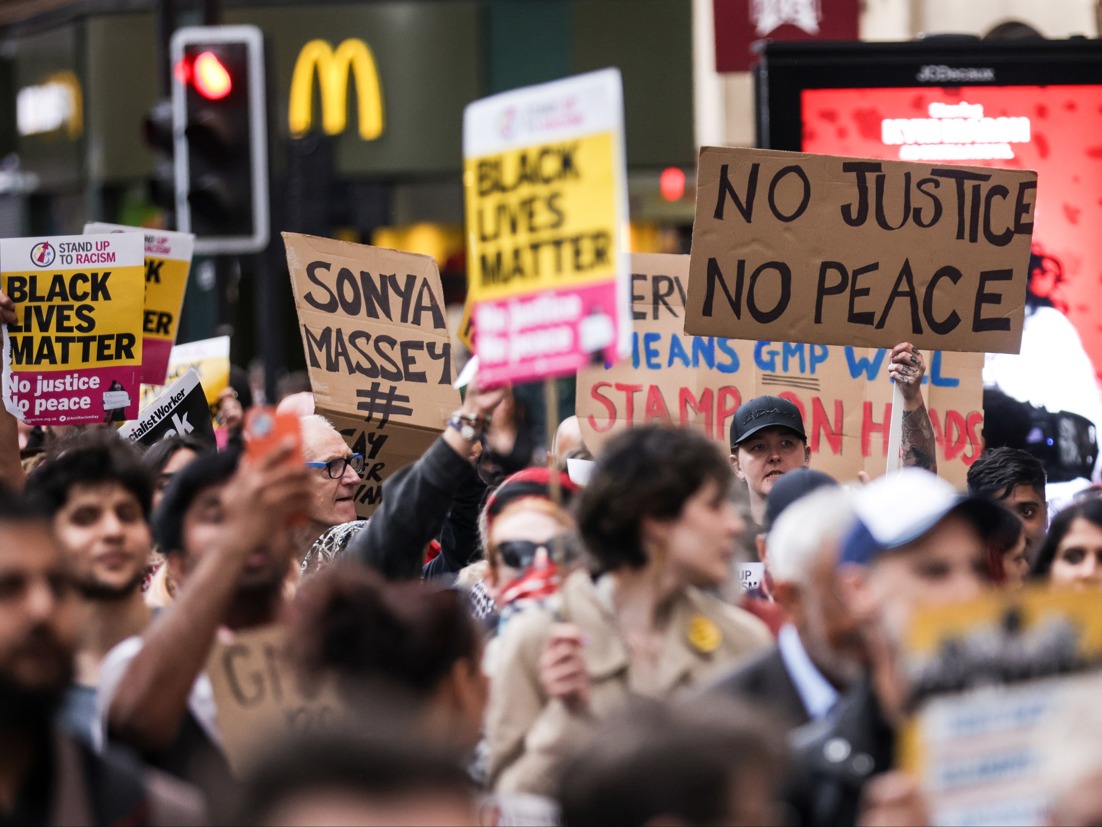 Banners held at the protest in Manchester on Thursday night included signs saying ‘no justice no peace’