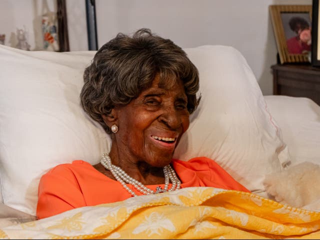 <p>Elizabeth Francis, pictured here lying in her bed, became the oldest living American in July when she turned 115-years-old</p>