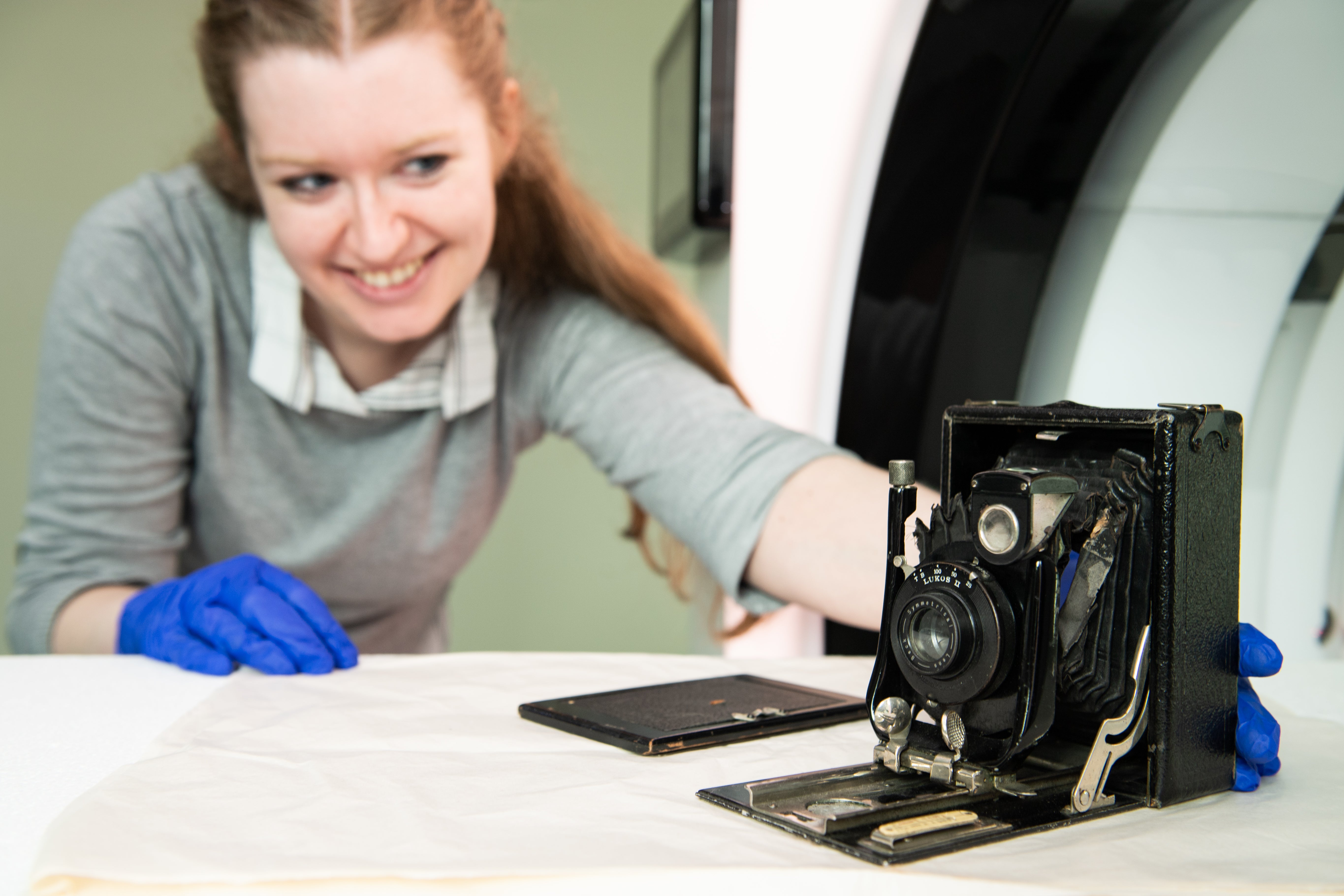 Eleanor Durrant, Conservator, National Science and Media Museum, positioning the ‘Cameo’ camera on the NewTom CBCT (Cone Beam CT) scanner at the University of Bradford (University of Bradford/PA)