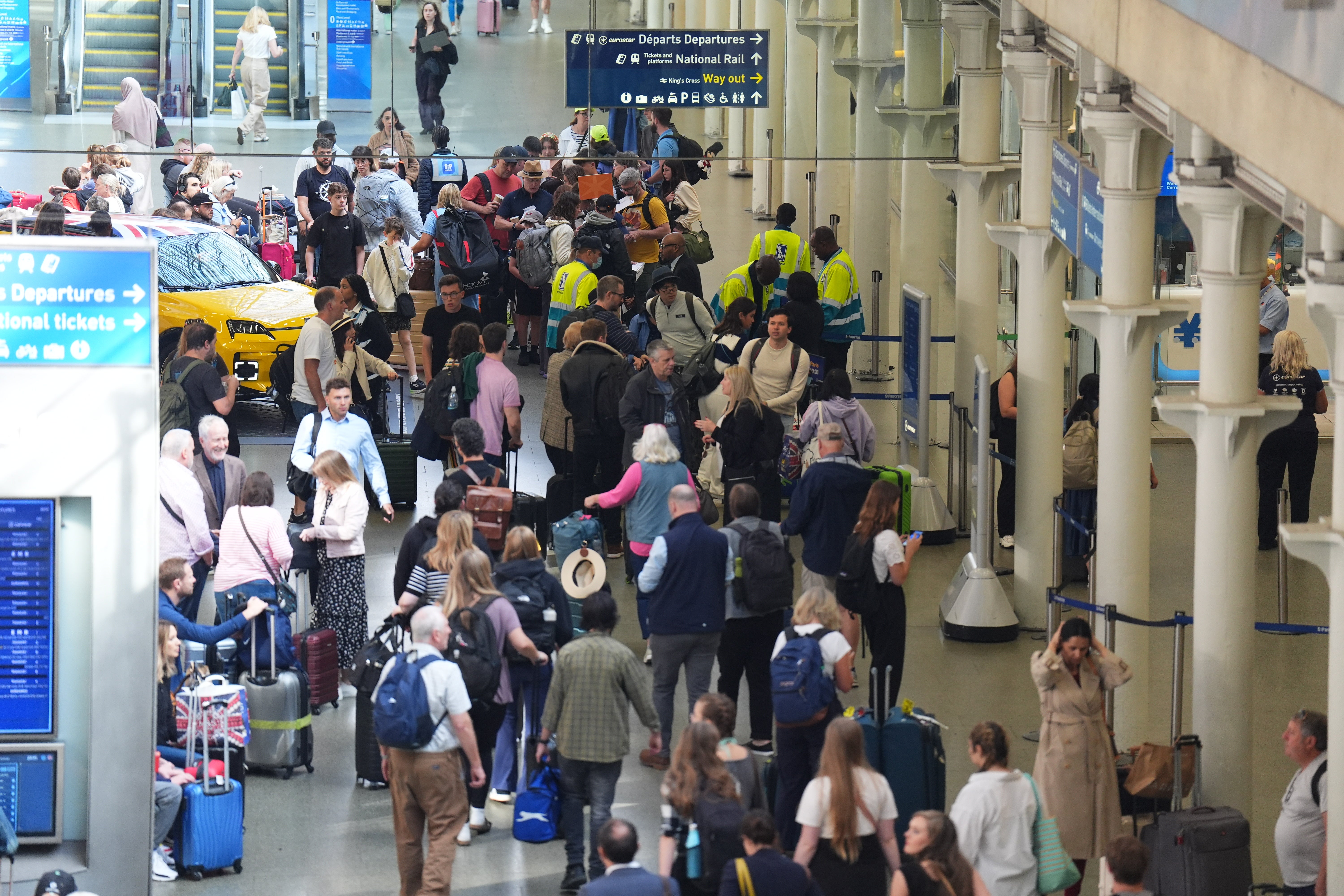 Passengers queue at the Eurostar terminal at St Pancras station in central London