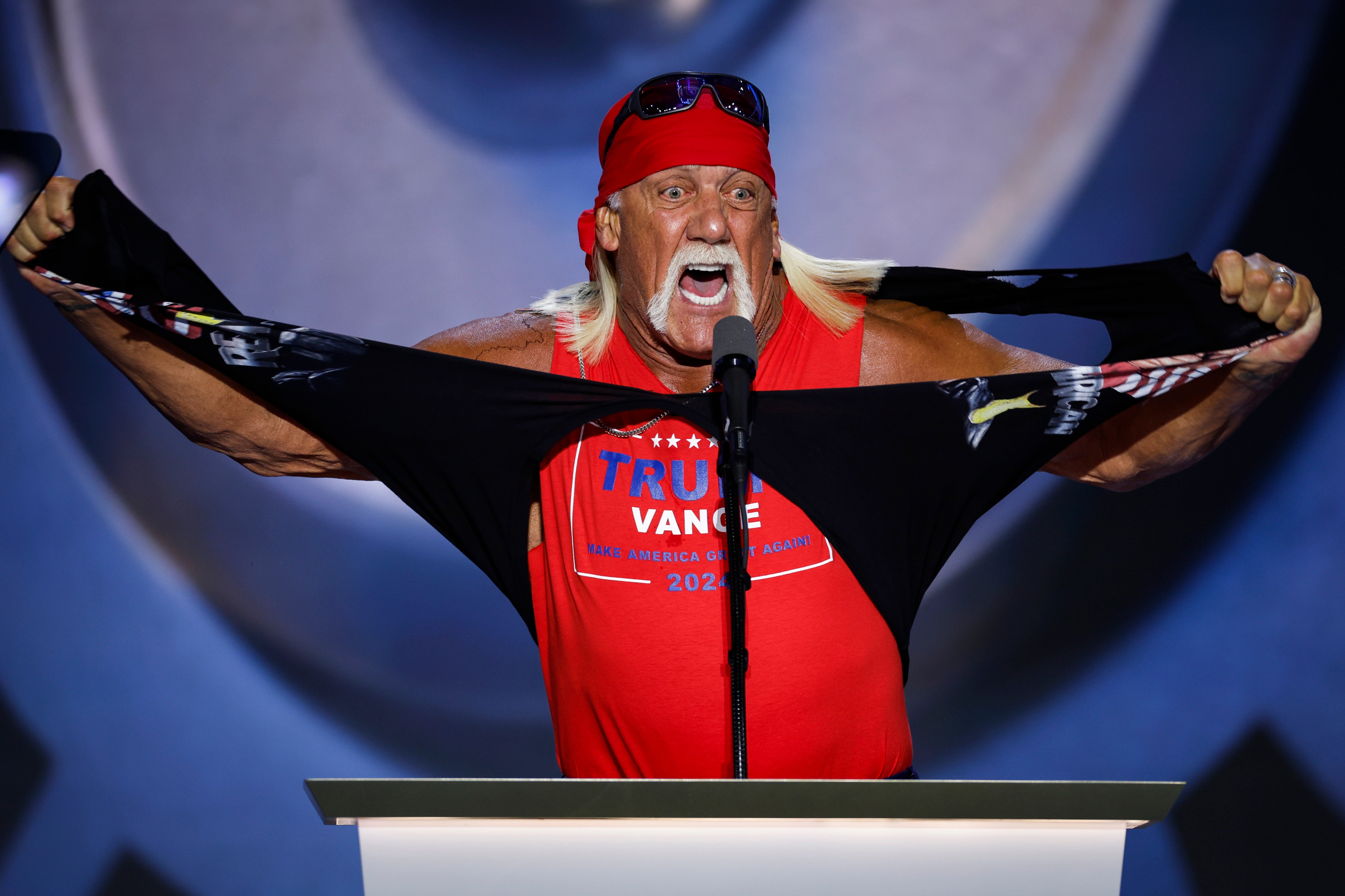 Professional wrestler Hulk Hogan rips his shirt as he speaks on stage on the fourth day of the Republican National Convention in Milwaukee, Wisconsin