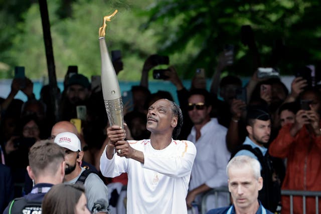 <p>Snoop Dogg carried the Olympic torch through Paris </p>
