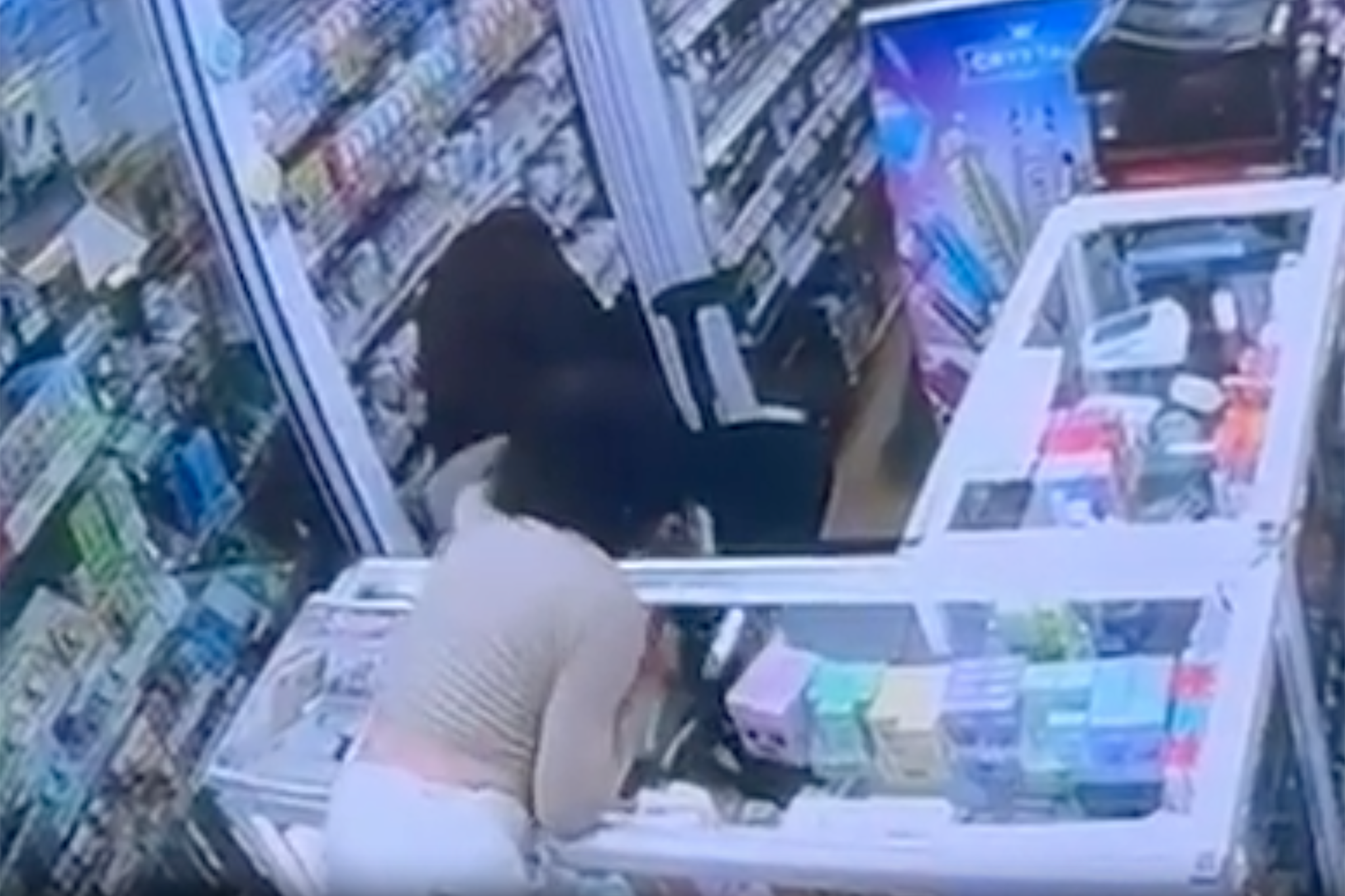 A woman runs into the corner shop and snatches a vape