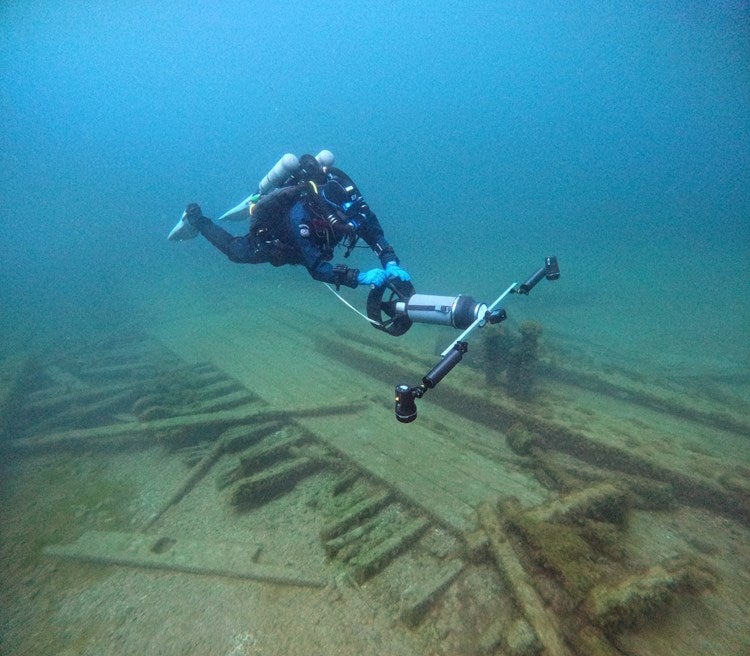 A diver from the Wisconsin Historical Society pictured collecting photos for a 3D model of the ship. The Wisconsin Underwater Archeological Association has been looking for the ship since 2023