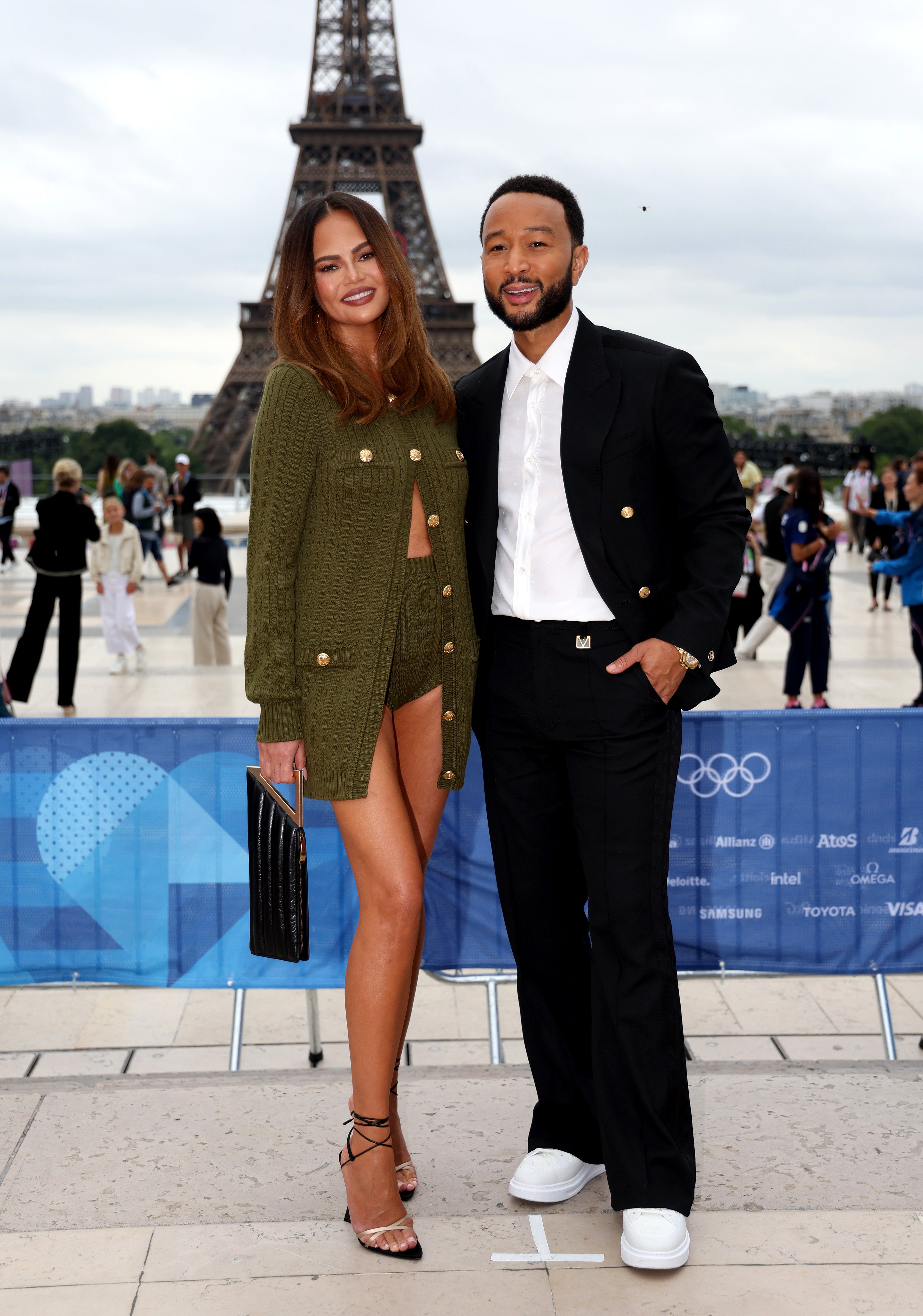 Teigen donned a matching army green jacket and micro-shorts set with lace-up, open-toe heels outside the opening ceremony entrance.