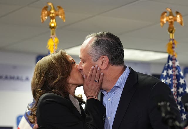 <p>Vice President Kamala Harris and Second Gentleman Doug Emhoff kiss at her campaign headquarters in Wilmington, Delaware, on July 22. Emhoff is now under scrutiny after he acknowledged an affair during his first marriage </p>