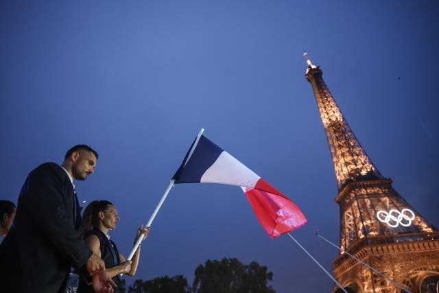 <p>The French team arrive at the Eiffel Tower during the Olympics opening ceremony </p>